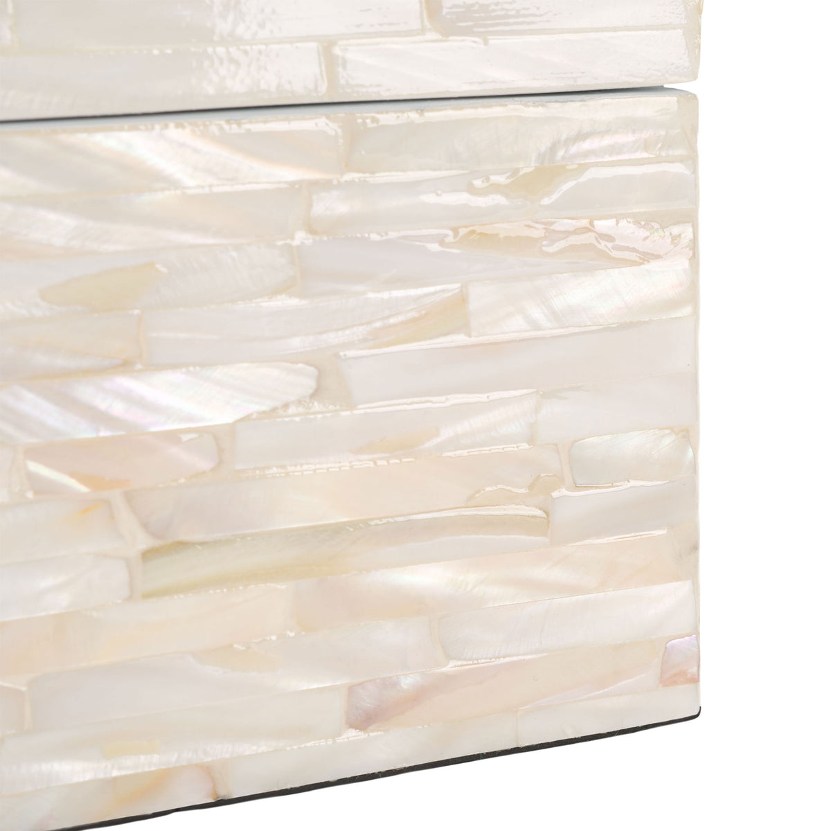 Iridescent shell strips shimmer along the box's lower edge in warm cream and champagne.