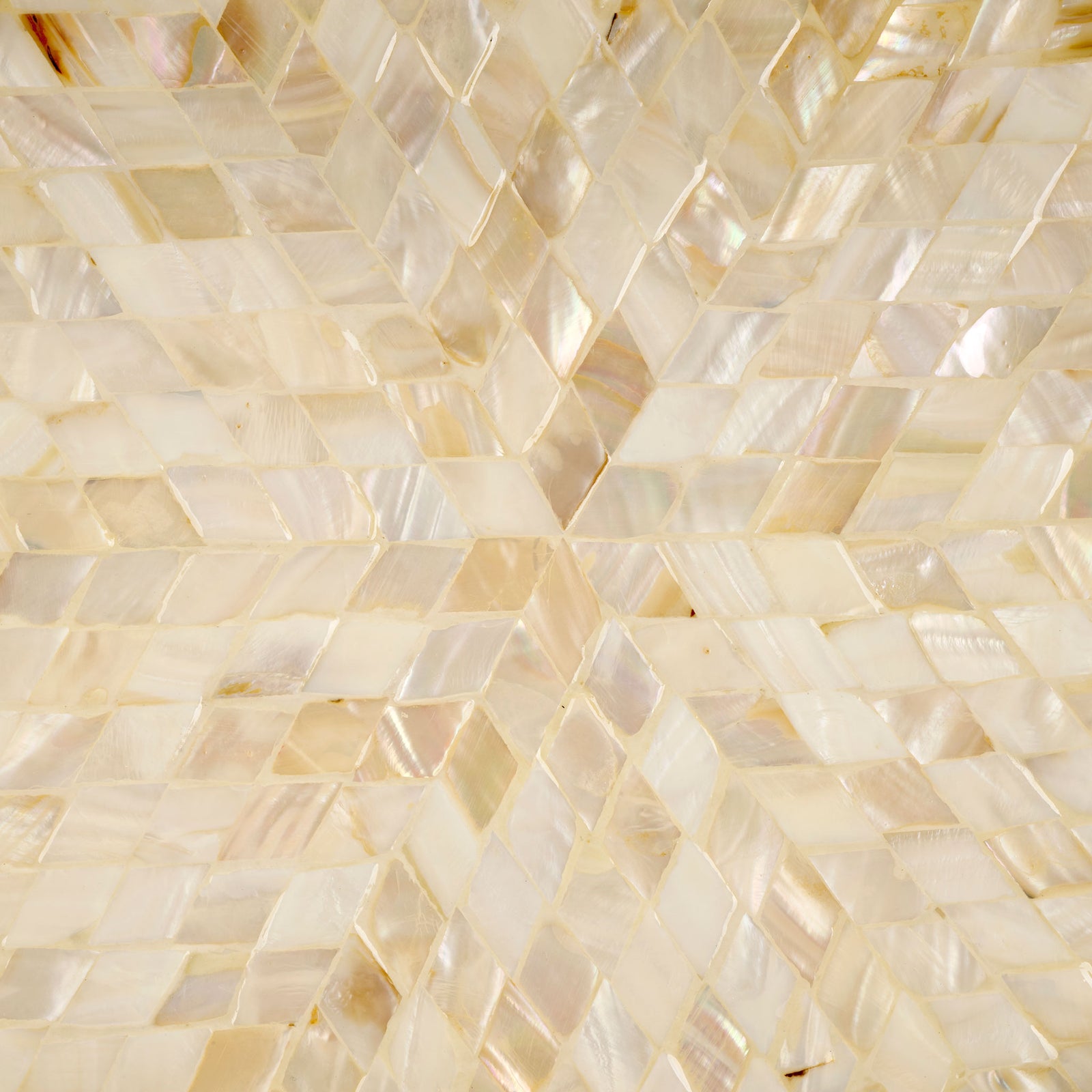 Champagne mother-of-pearl tiles create a shimmering herringbone sunburst with natural variation || STG1811A || swatch_studio