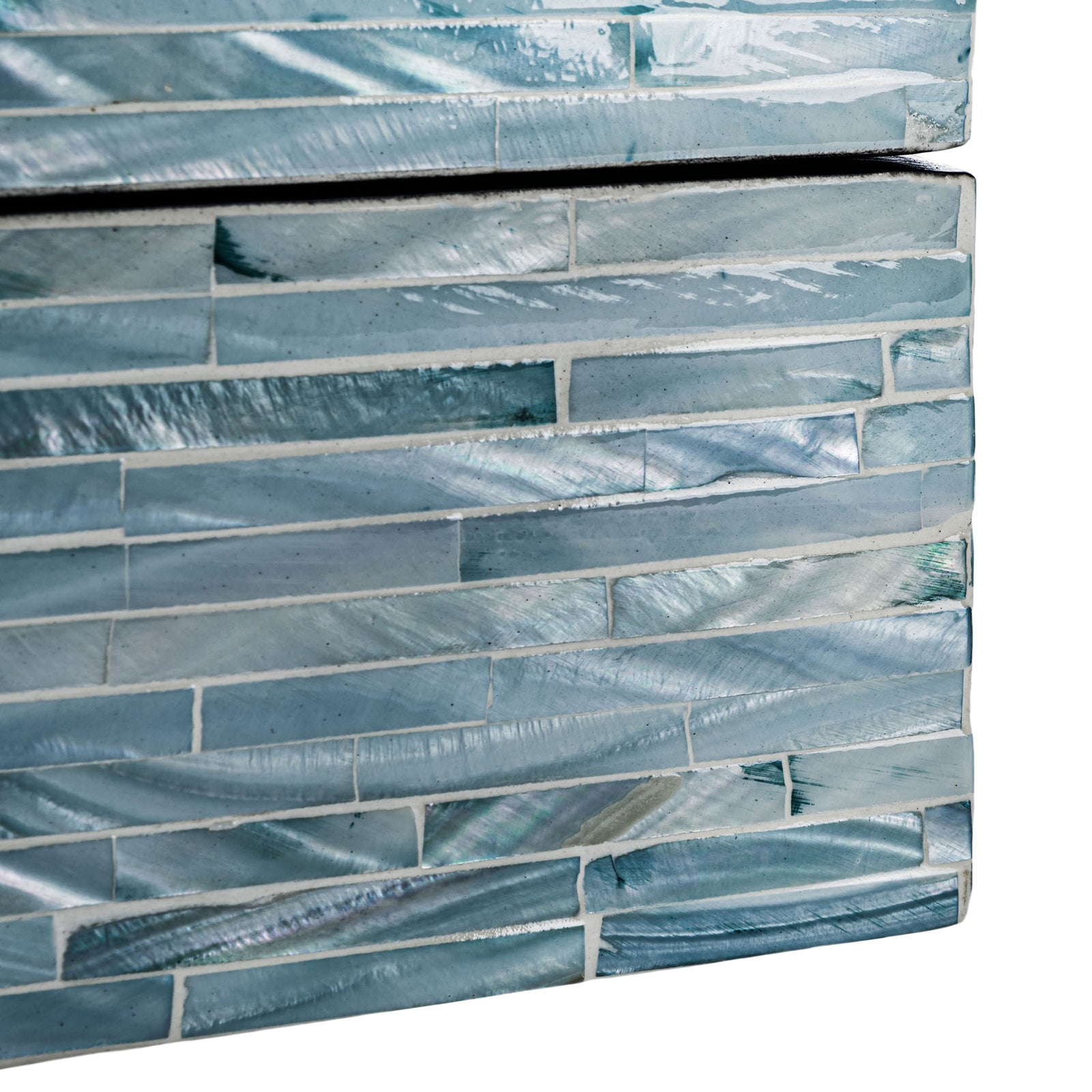 Iridescent shell tiles vary from silvery gray to deep blue across a decorative box's lower corner. || STG1812A || detail_studio
