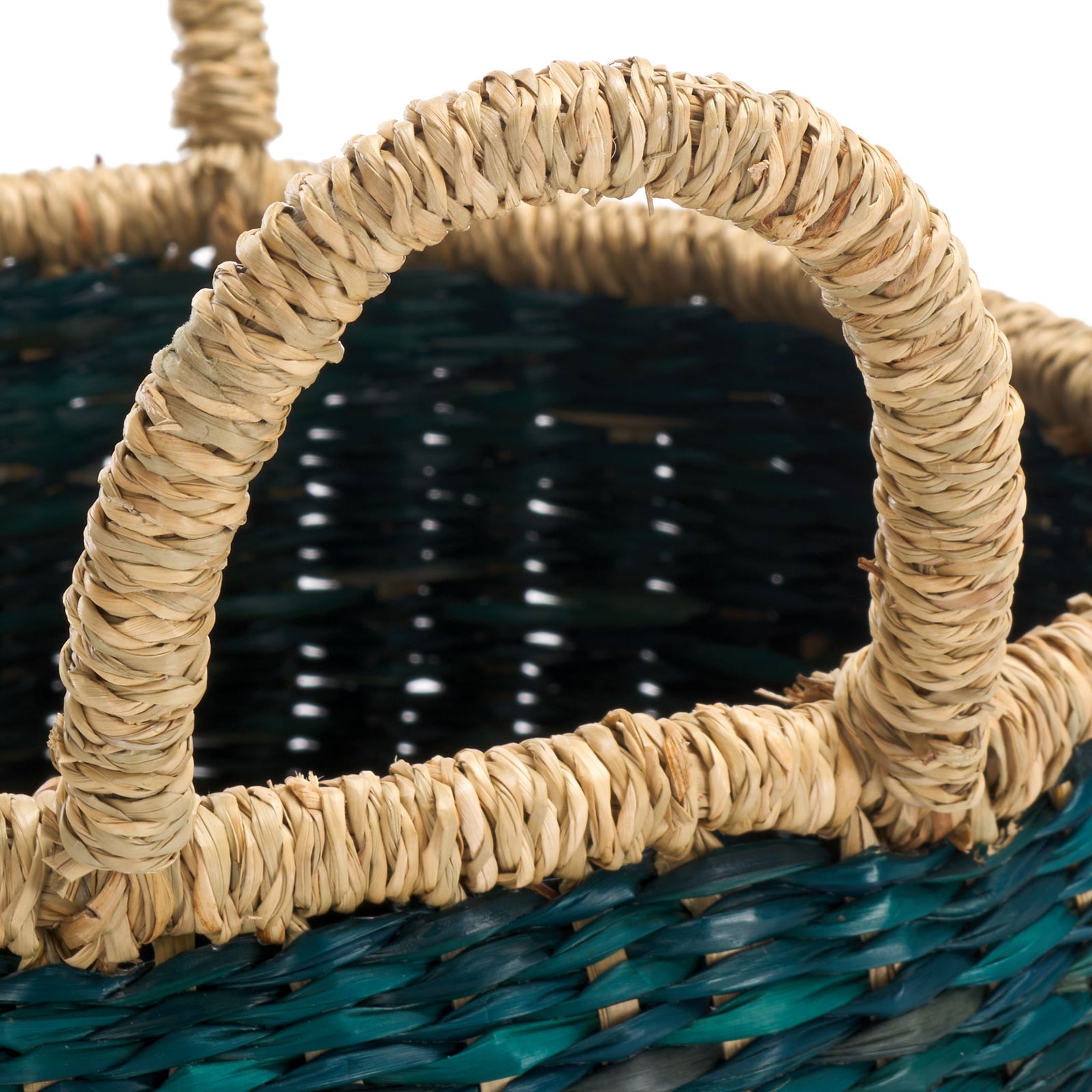A sturdy natural seagrass loop handle rises above the basket's green weave || STG1815A || handle_studio