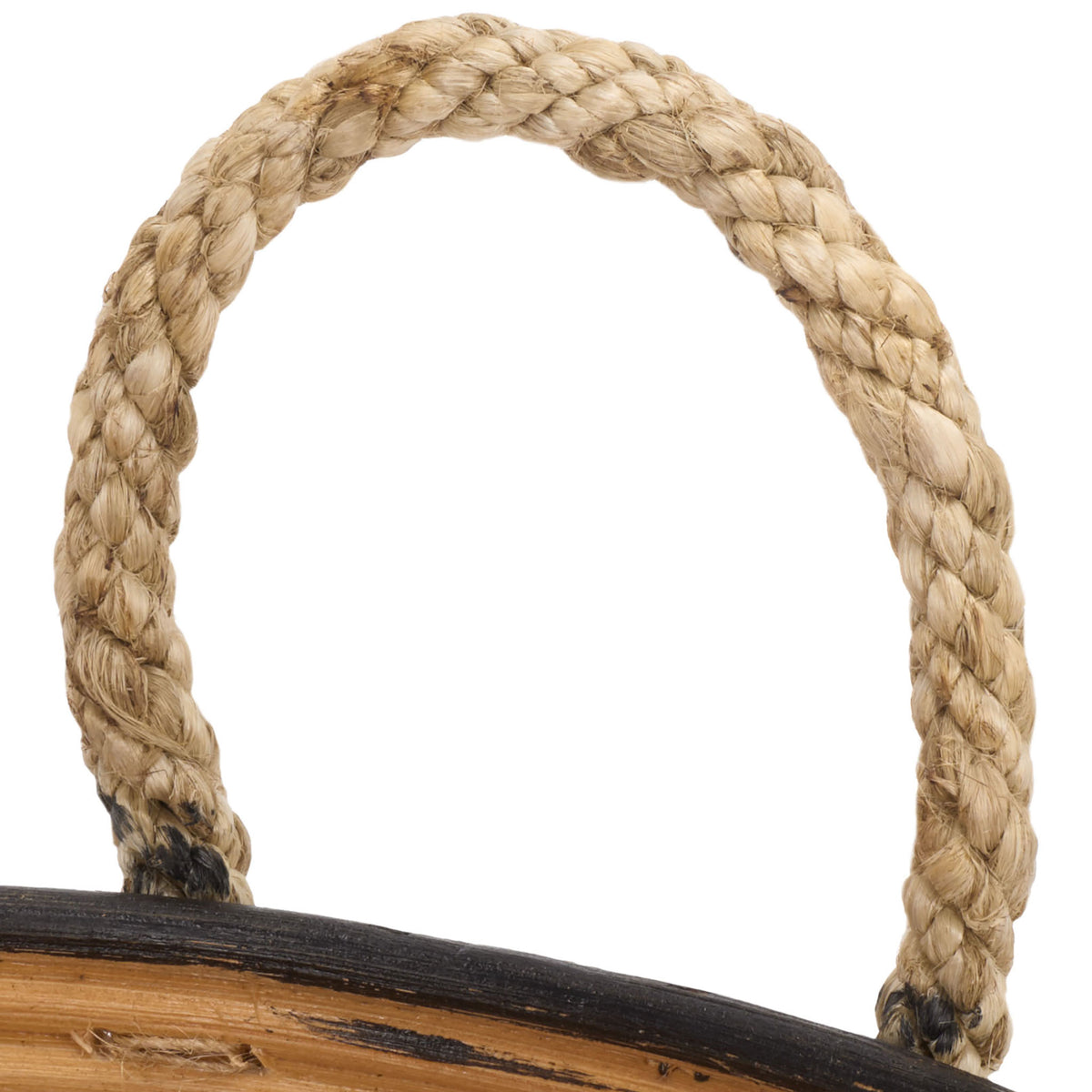 A thick braided rope handle adds tactile warmth to the basket's black rattan edge || STG1816A || handle_studio