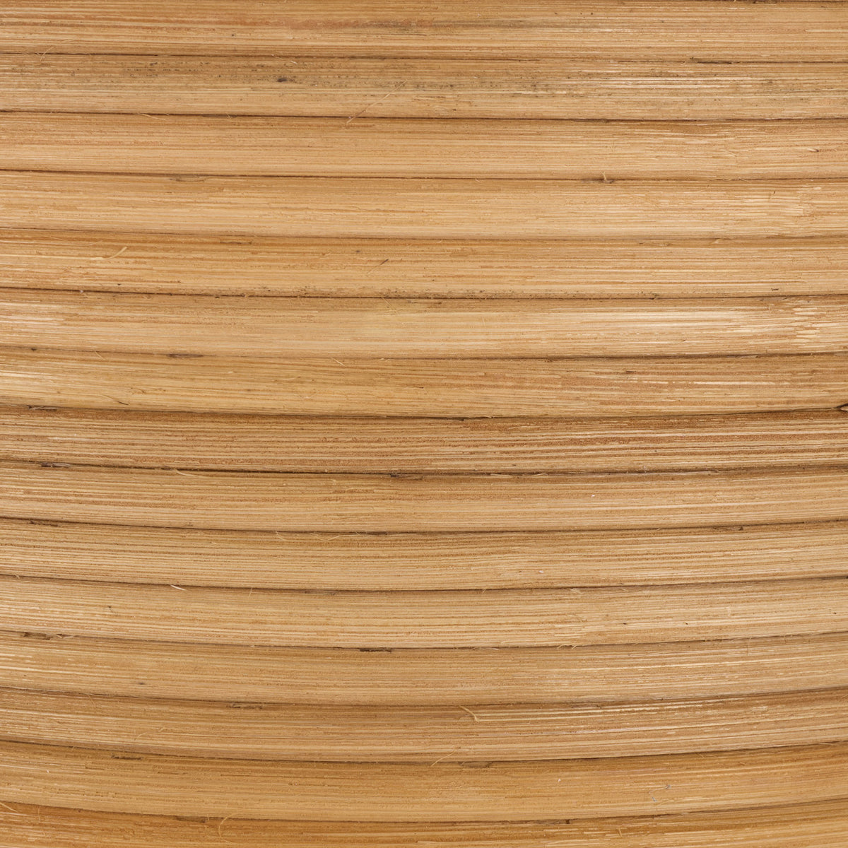 Warm tan tones and fine natural grain accent the basket's tightly coiled rattan. || STG1817A || swatch_studio
