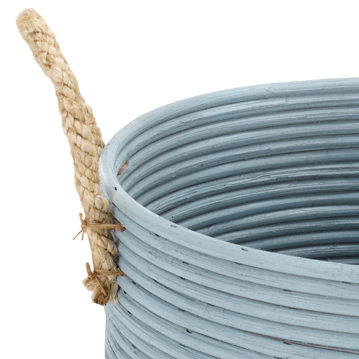 Light blue rattan coils meet a natural braided handle at the basket's open rim.
