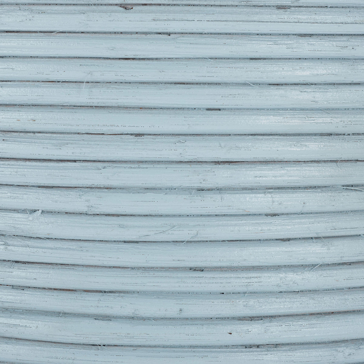 A pale blue finish highlights tightly coiled rattan texture and subtle natural striations. || STG1817B || swatch_studio