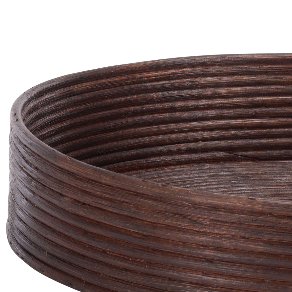 Rounded rattan rims and tightly coiled sides add texture to the dark brown tray baskets || STG1818A || detail_studio