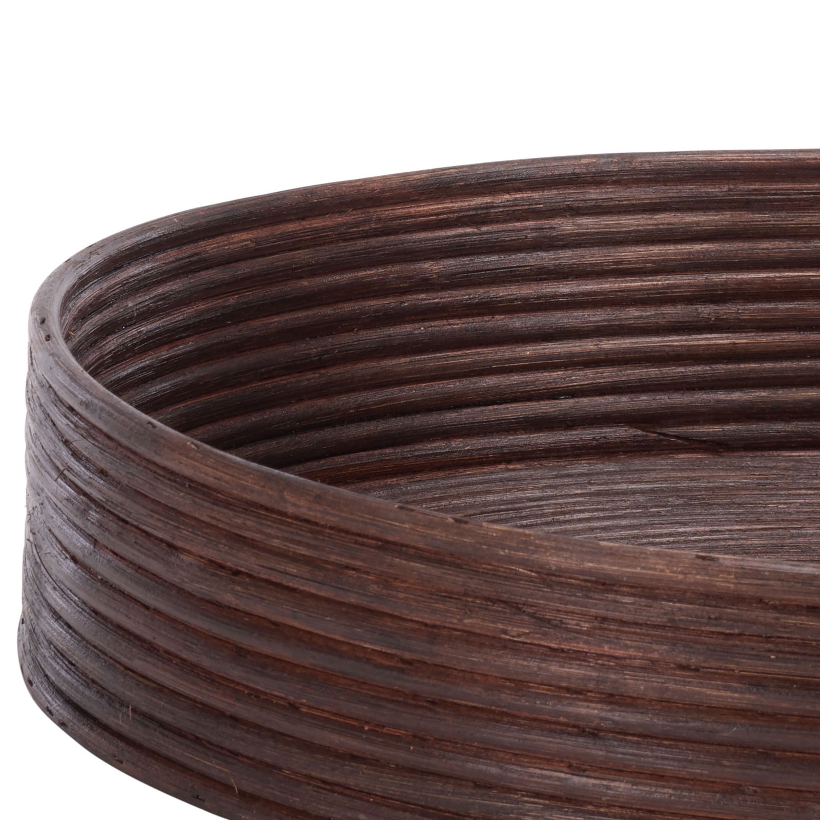 Rounded rattan rims and tightly coiled sides add texture to the dark brown tray baskets || STG1818A || detail_studio