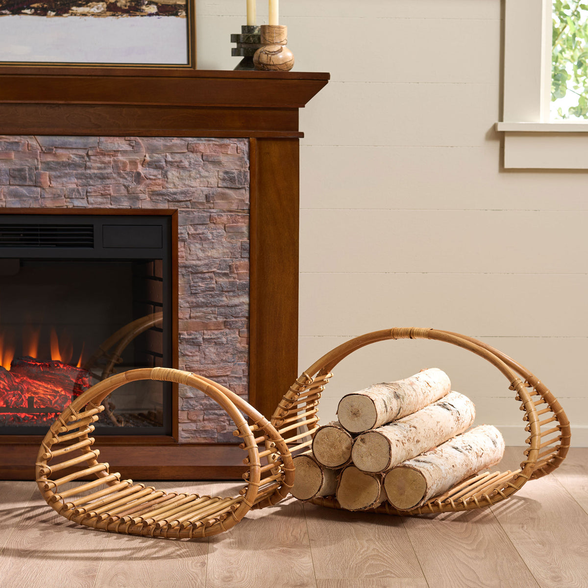 Two curved rattan baskets organize firewood beside the hearth and add natural warmth. || STG1819A || front_angle_room