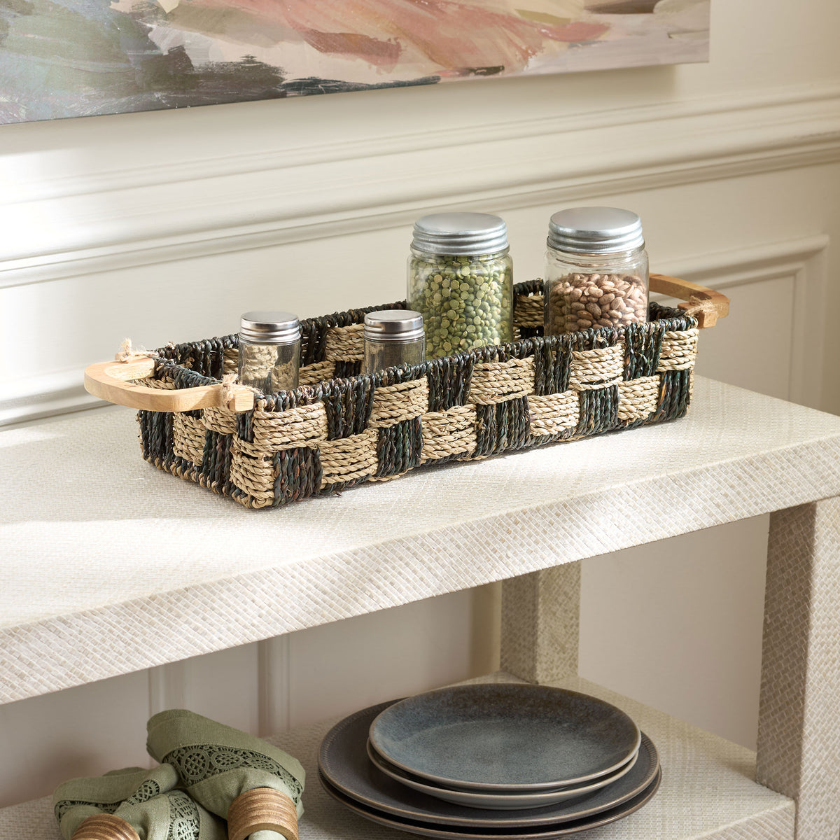 Two-tone woven basket keeps pantry jars together with wood handles at either end || STG1820A || front_angle_room
