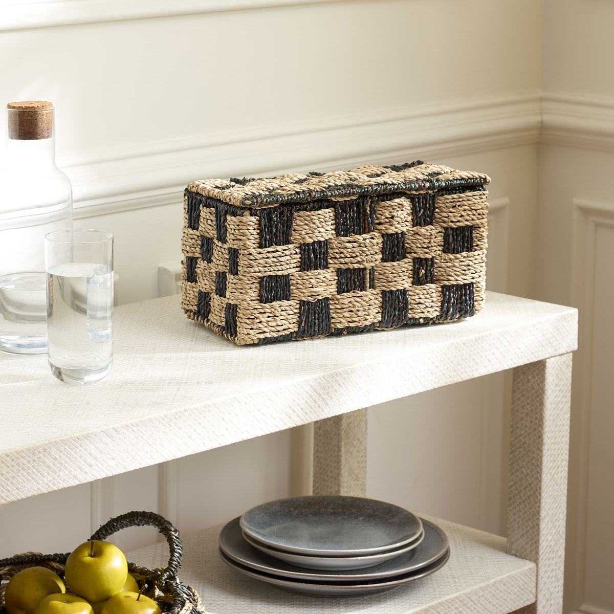 A fitted woven lid gives this two-tone basket a tidy look for dining area storage. || STG1822A || front_angle_room