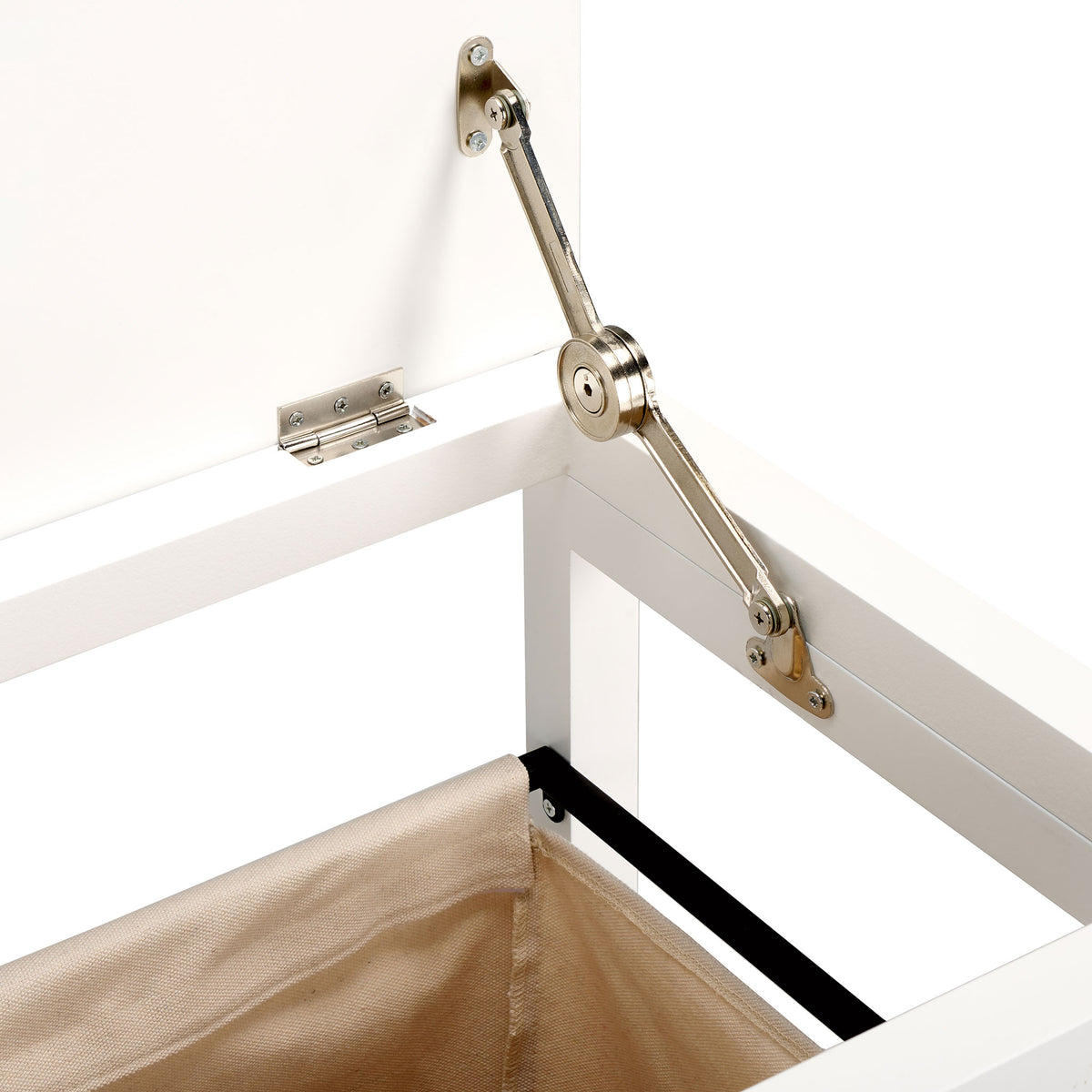 A metal support hinge holds the lifted white lid above a beige laundry bag. || STG1900A || detail_studio