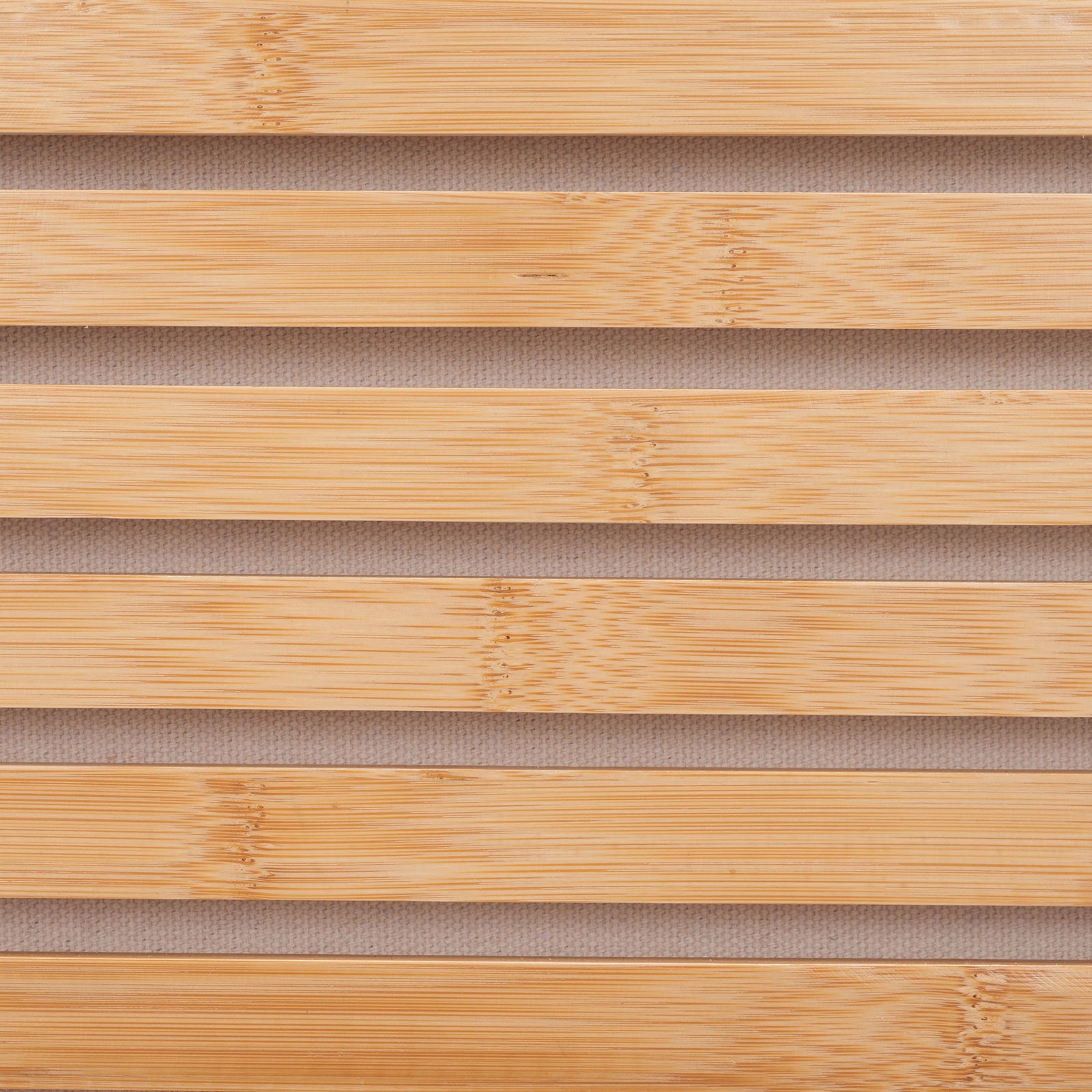 Golden bamboo slats reveal natural grain against the hamper's beige fabric lining || STG1903A || swatch_studio