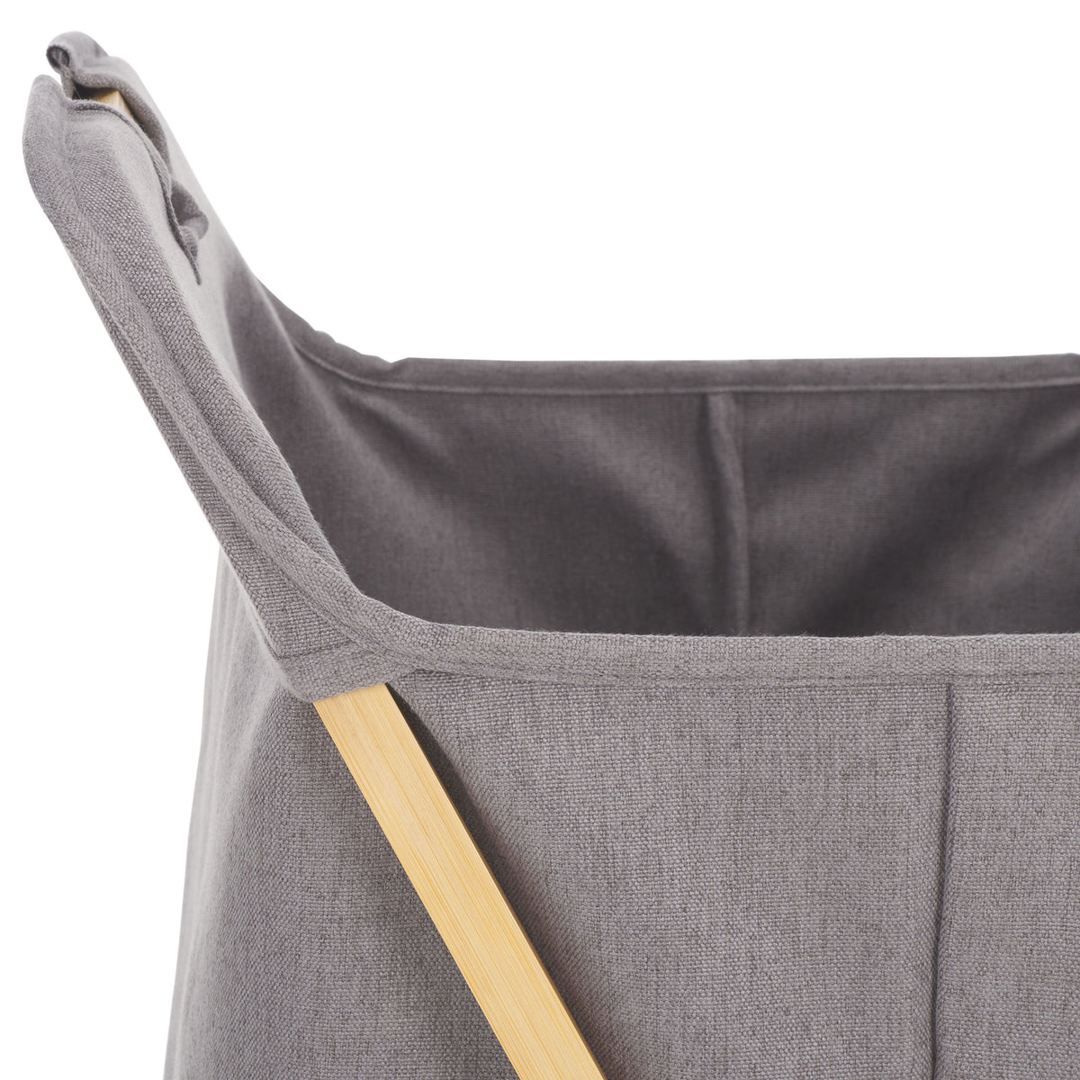The open gray fabric basket reveals a dark lining within its bamboo-supported rim.