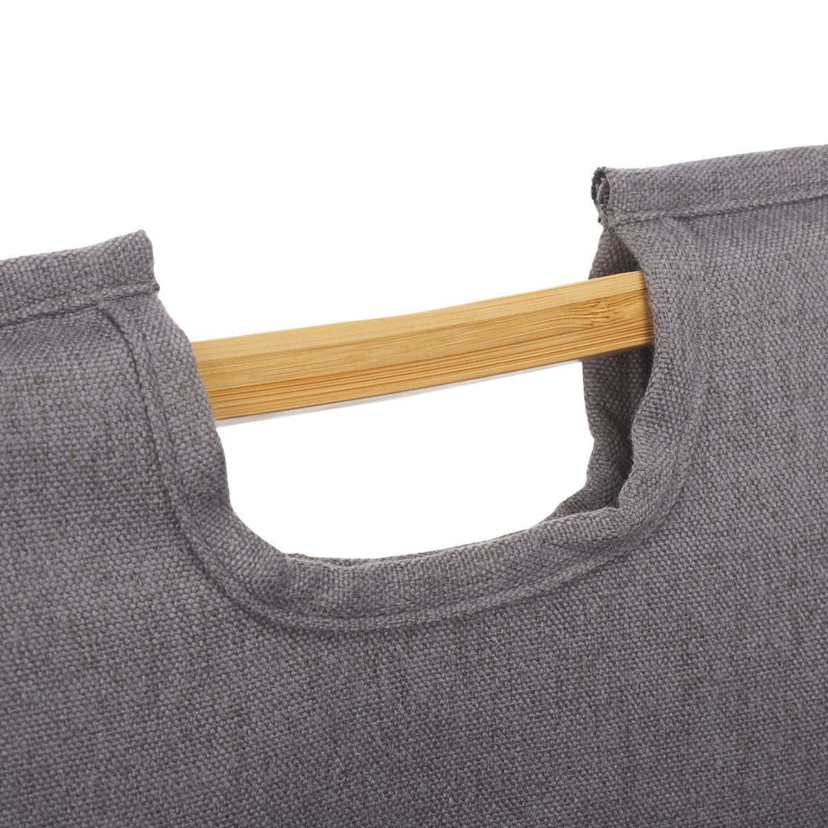 A cutout fabric handhold wraps around a natural bamboo bar for easy carrying. || STG1906A || handle_studio
