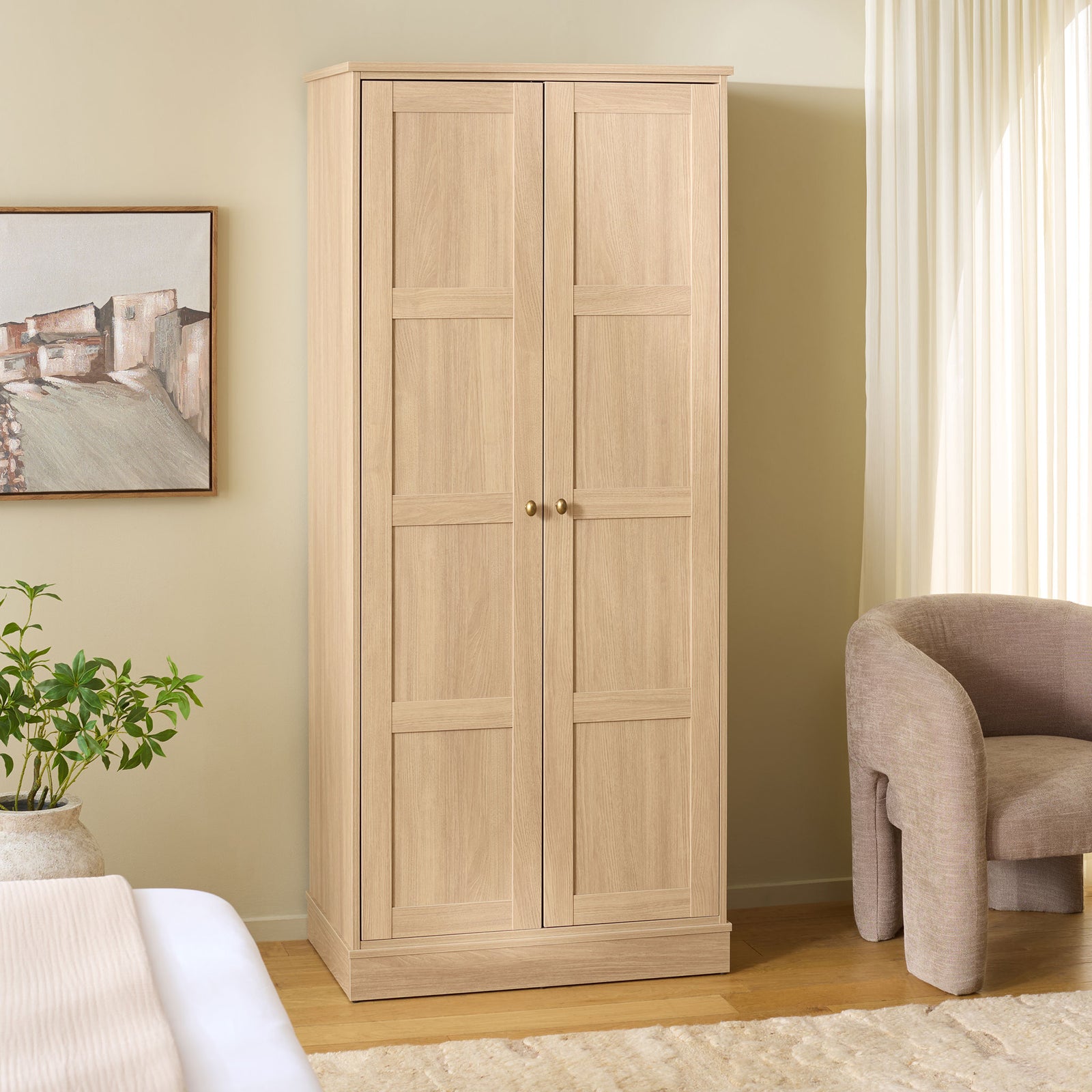 Light wood-look paneled wardrobe warms the bedroom while keeping clothes tucked away. || STG3102B-2BX || front_angle_room