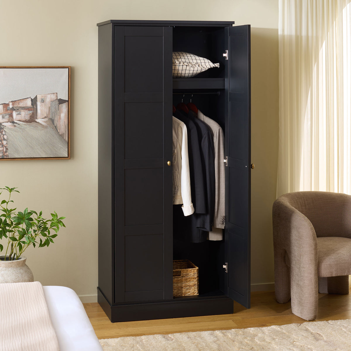 An open door reveals hanging clothes beneath a shelf, with basket space at the base.