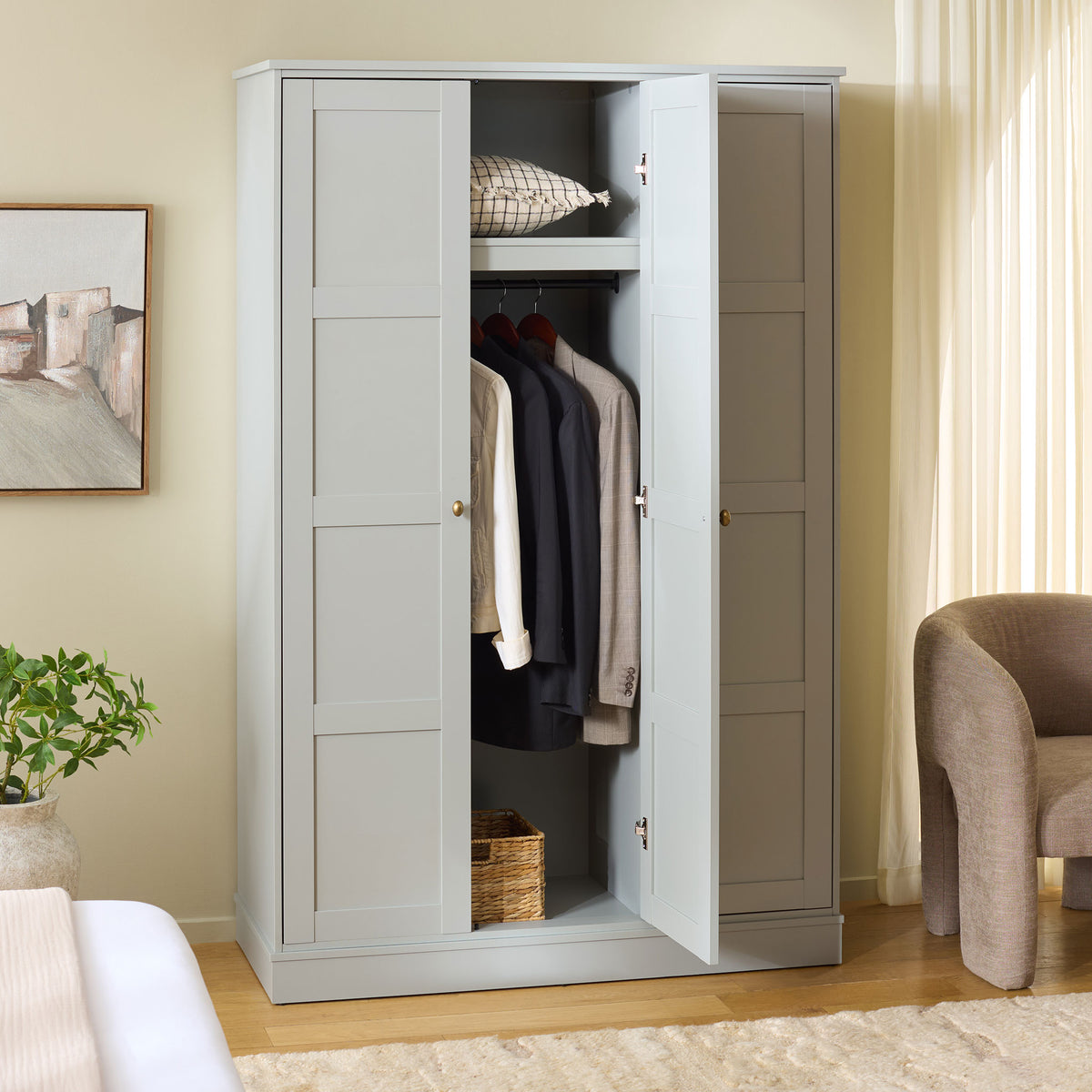 An open center door shows hanging clothes below a shelf, with closed storage at either side.