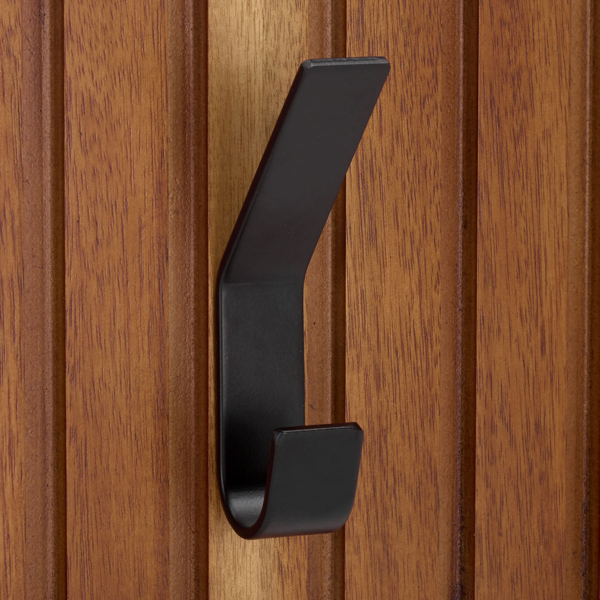 A black metal hook contrasts with the richly grained wood slats || STG5000A || detail_studio