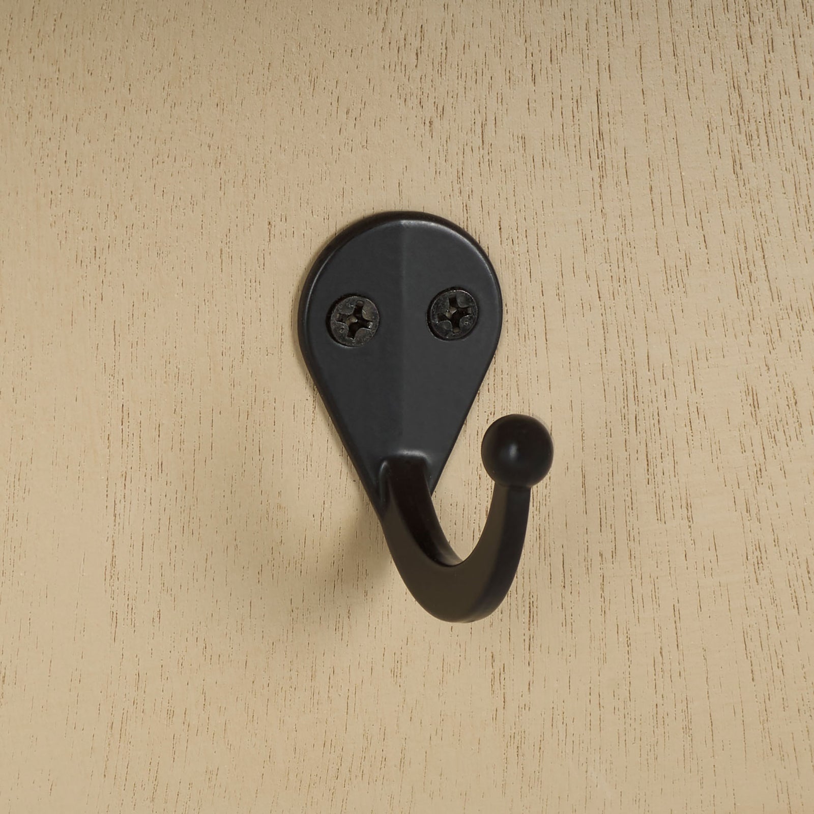 A black metal hook contrasts with the pale natural wood finish || STG5702A || detail_studio