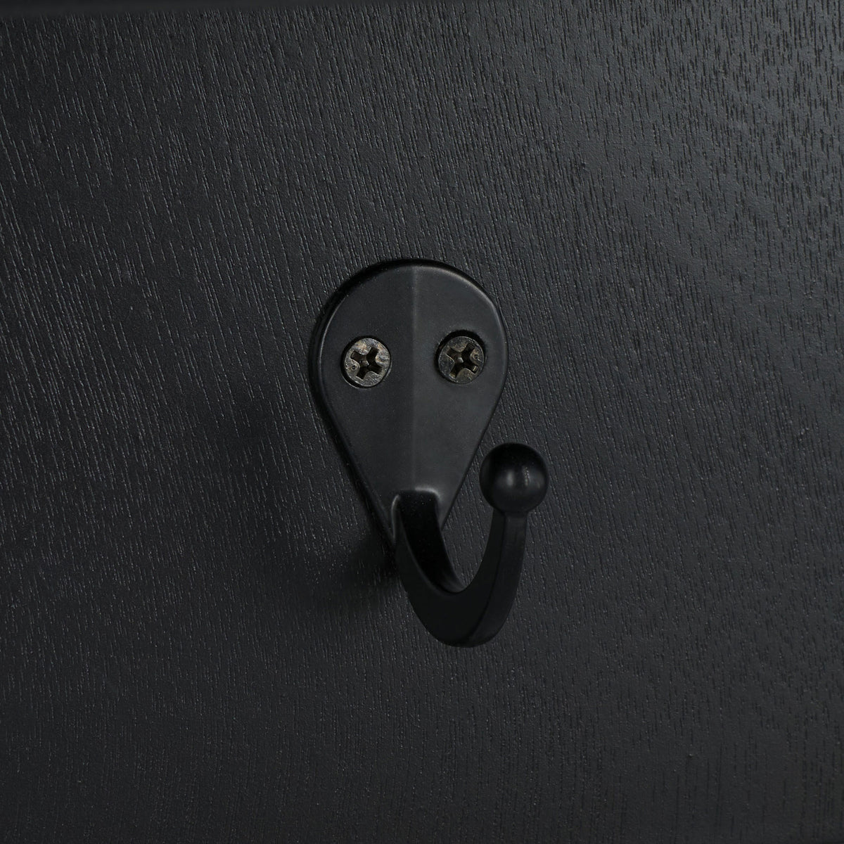 A rounded black metal hook blends with the matte black wood grain || STG5702B || detail_studio