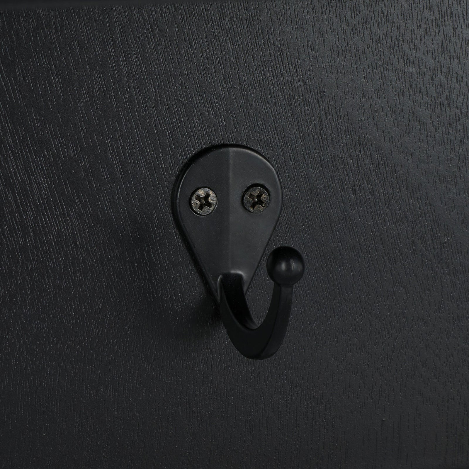 A rounded black metal hook blends with the matte black wood grain || STG5702B || detail_studio