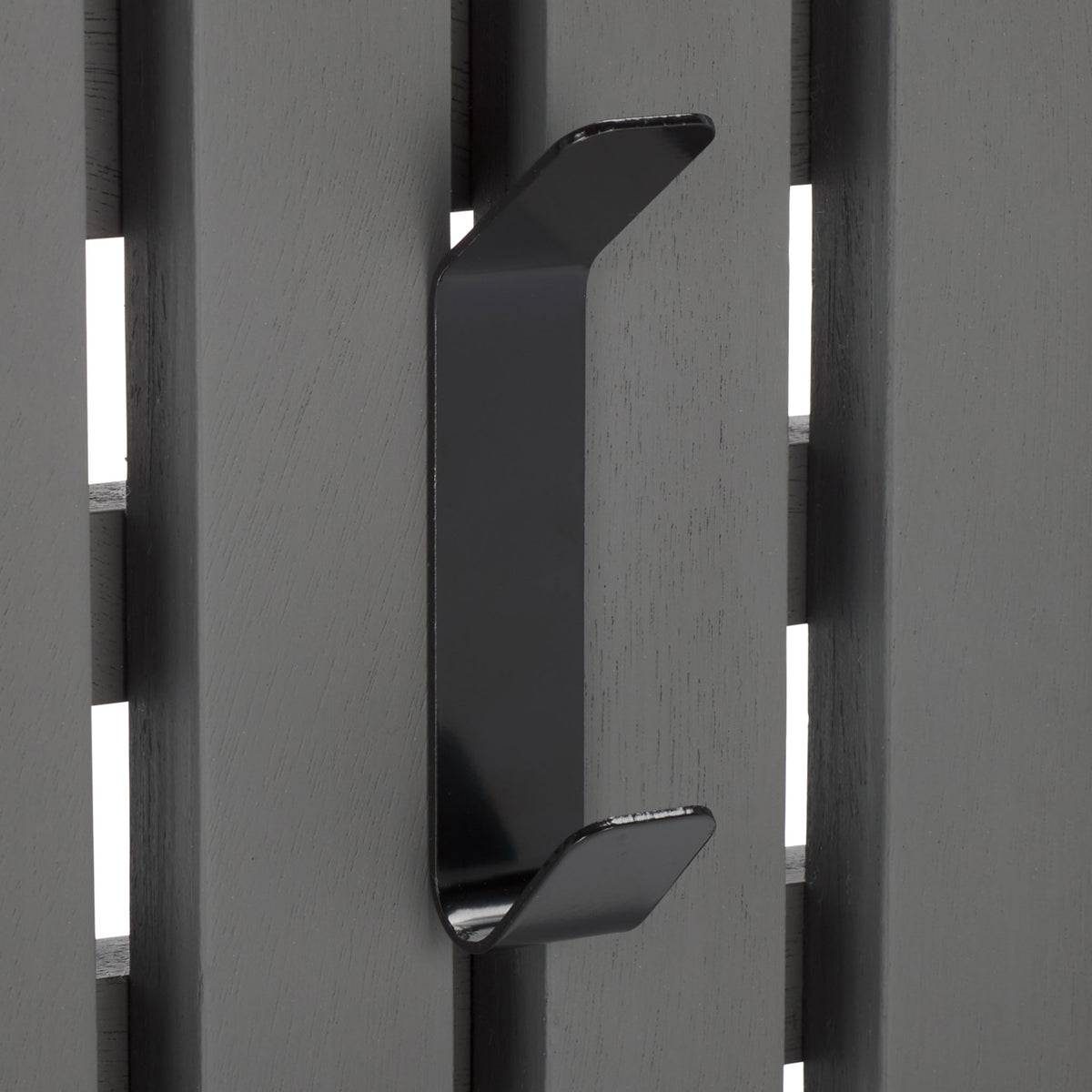 A black double hook sits against cool gray wood slats, offering two places for coats and accessories. || STG5704A || detail_studio