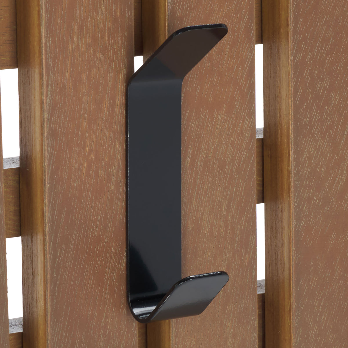 A black double hook stands out against warm sepia wood grain, keeping coats and bags close at hand. || STG5704B || detail_studio
