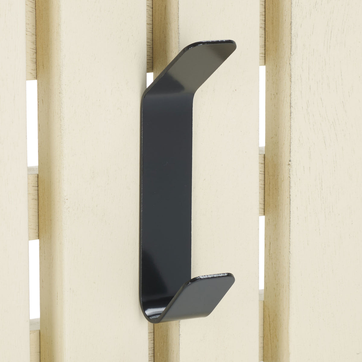 A black double hook contrasts with softly distressed white slats for practical, rustic wall storage. || STG5704L || detail_studio