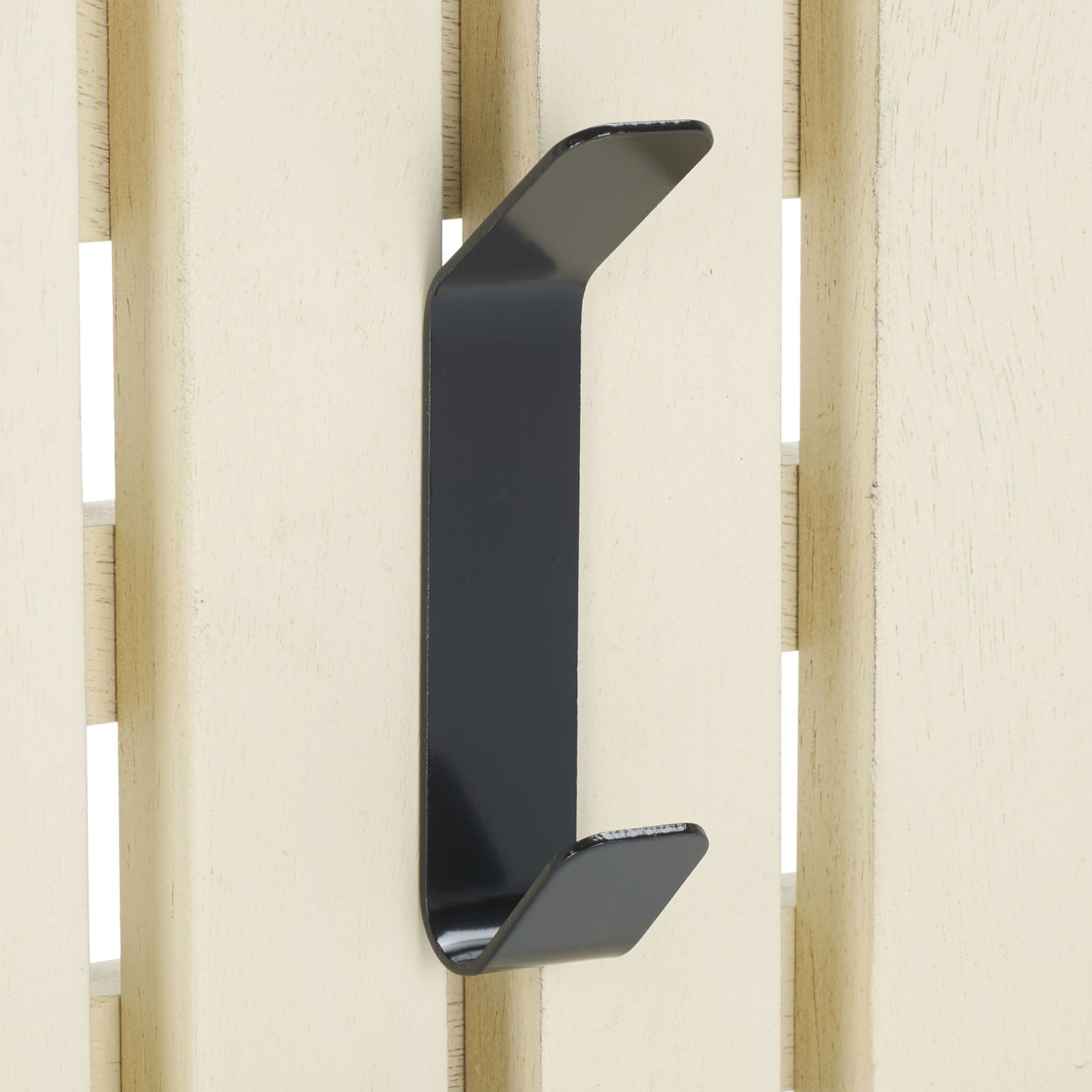 A black double hook contrasts with softly distressed white slats for practical, rustic wall storage. || STG5704L || detail_studio