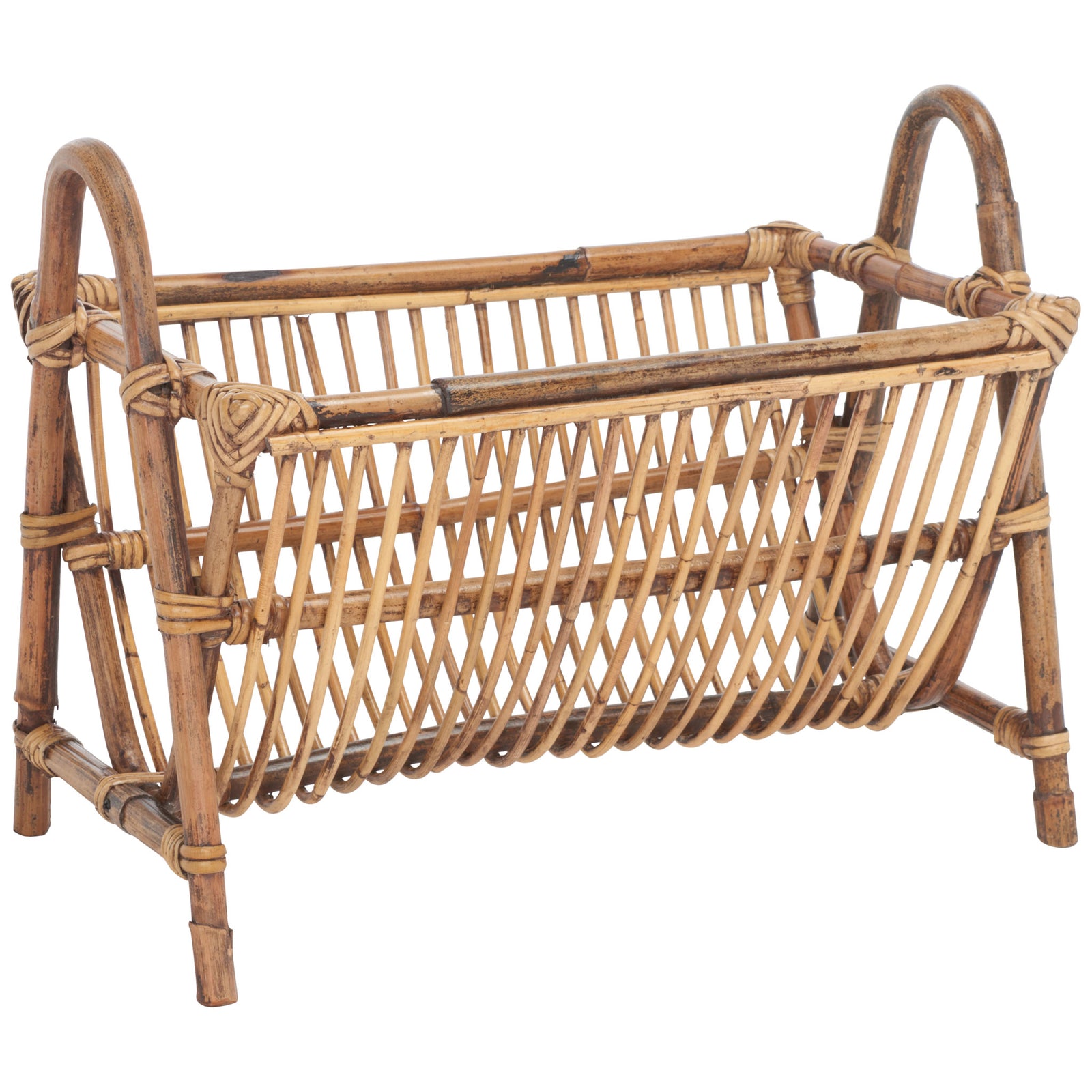 Warm rattan rails form an airy magazine cradle with arched carrying handles || STG6500A || front_angle_studio