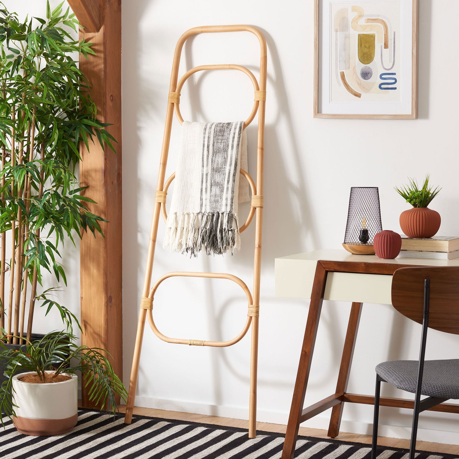 Natural rattan tiers display a fringed throw while adding relaxed texture to the room || STG6502A || front_room