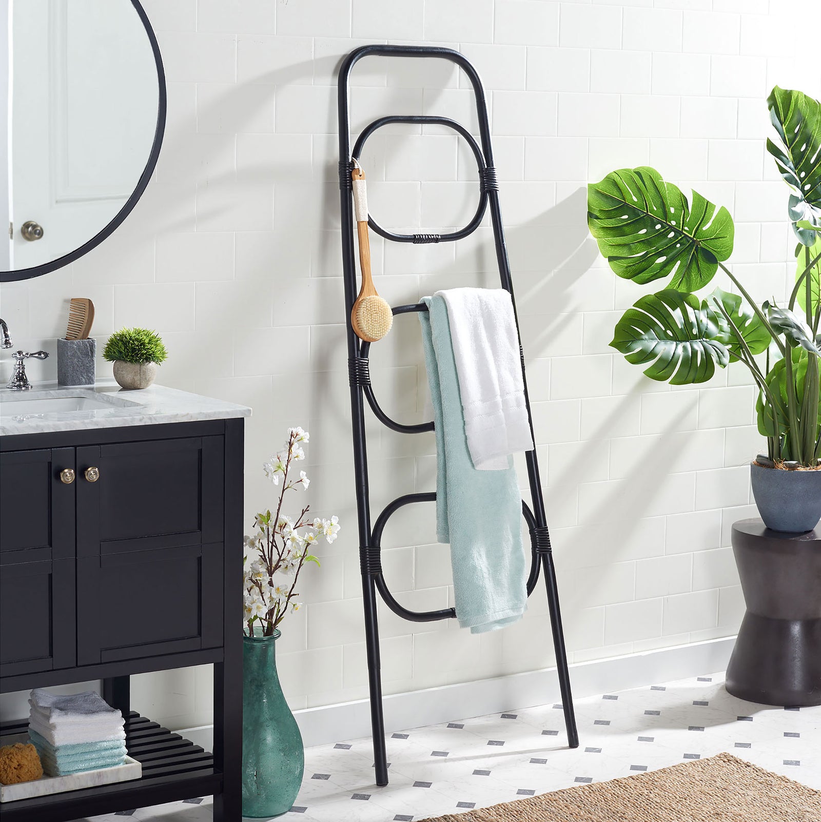 Three black rattan tiers organize bath towels beside a vanity without crowding the floor || STG6502B || front_angle_room