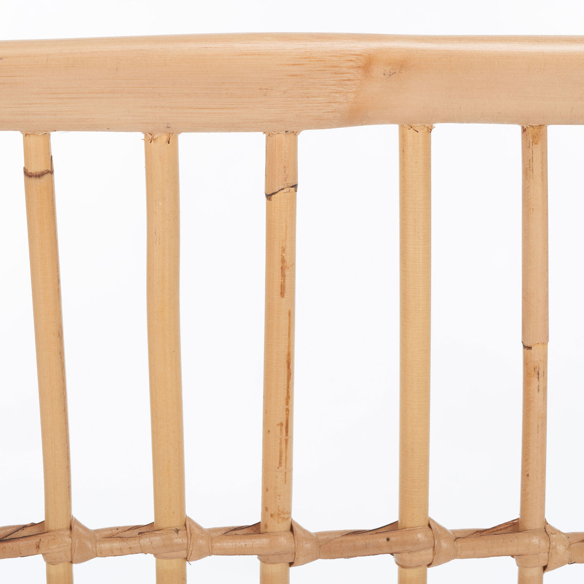 Natural rattan shows subtle grain and tonal variation across smooth rails and slender slats. || STG6505A || swatch_studio