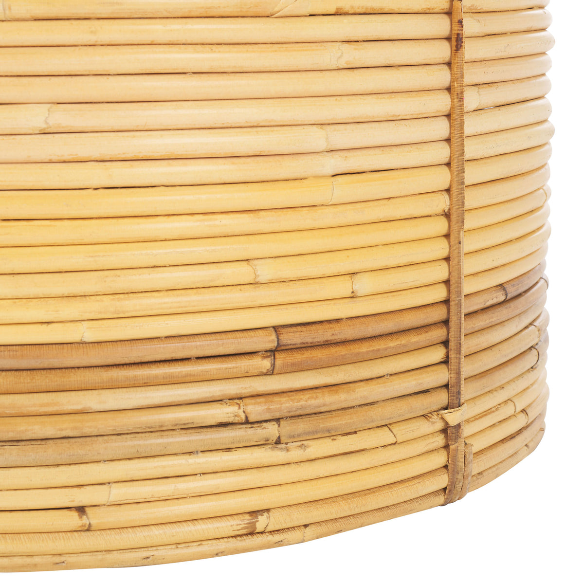 Coiled rattan and a darker natural band bring subtle contrast to the basket's rounded base. || STG6508A || leg_studio