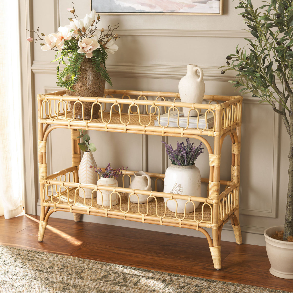 Flowers and pottery bring charm to the natural rattan console's two open display shelves || STG6509A || front_angle_room