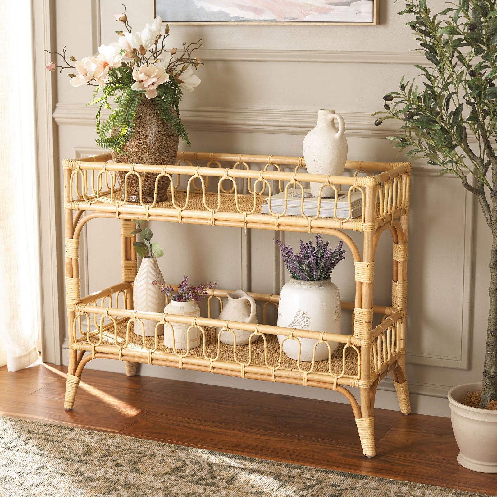 Flowers and pottery bring charm to the natural rattan console's two open display shelves || STG6509A || front_angle_room