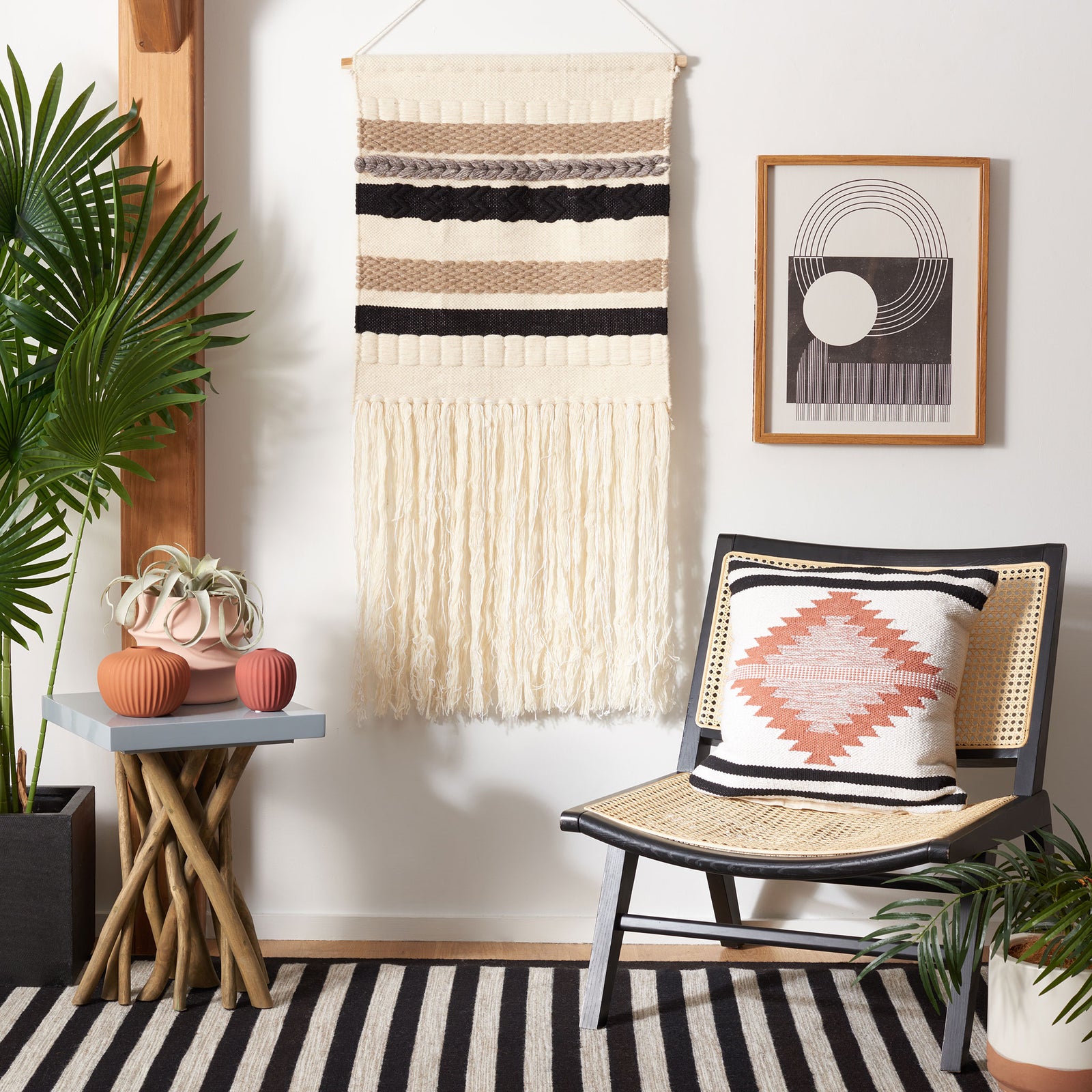 Bold black and taupe stripes give the ivory wool wall tapestry a graphic look above its flowing fringe. || SWA121Z-2 || front_room