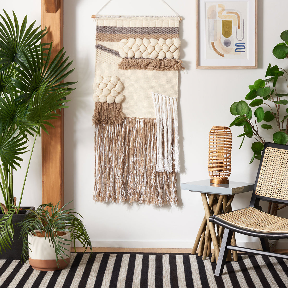 Ivory-and-brown wall tapestry pairs clustered wool knots with layered fringe for earthy texture.