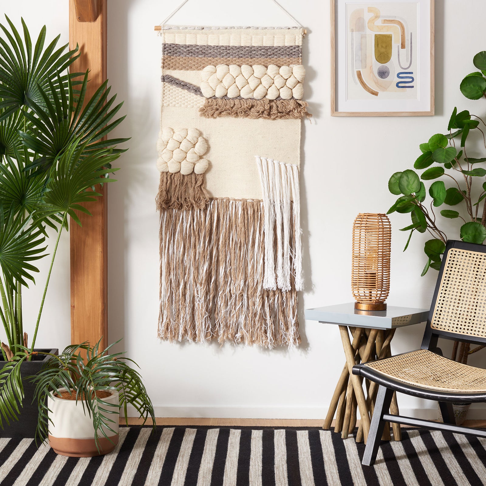 Ivory-and-brown wall tapestry pairs clustered wool knots with layered fringe for earthy texture. || SWA122T-2 || front_room