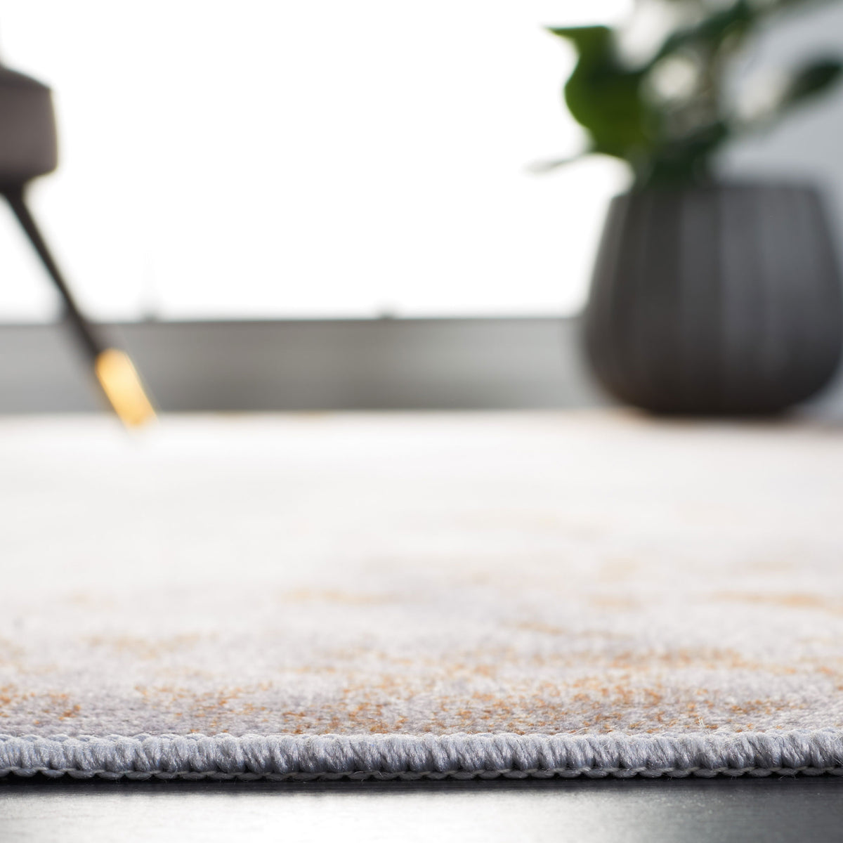 Low-profile rug sits flat under furniture for a clean, modern look || TAC802P-5 || detail_room