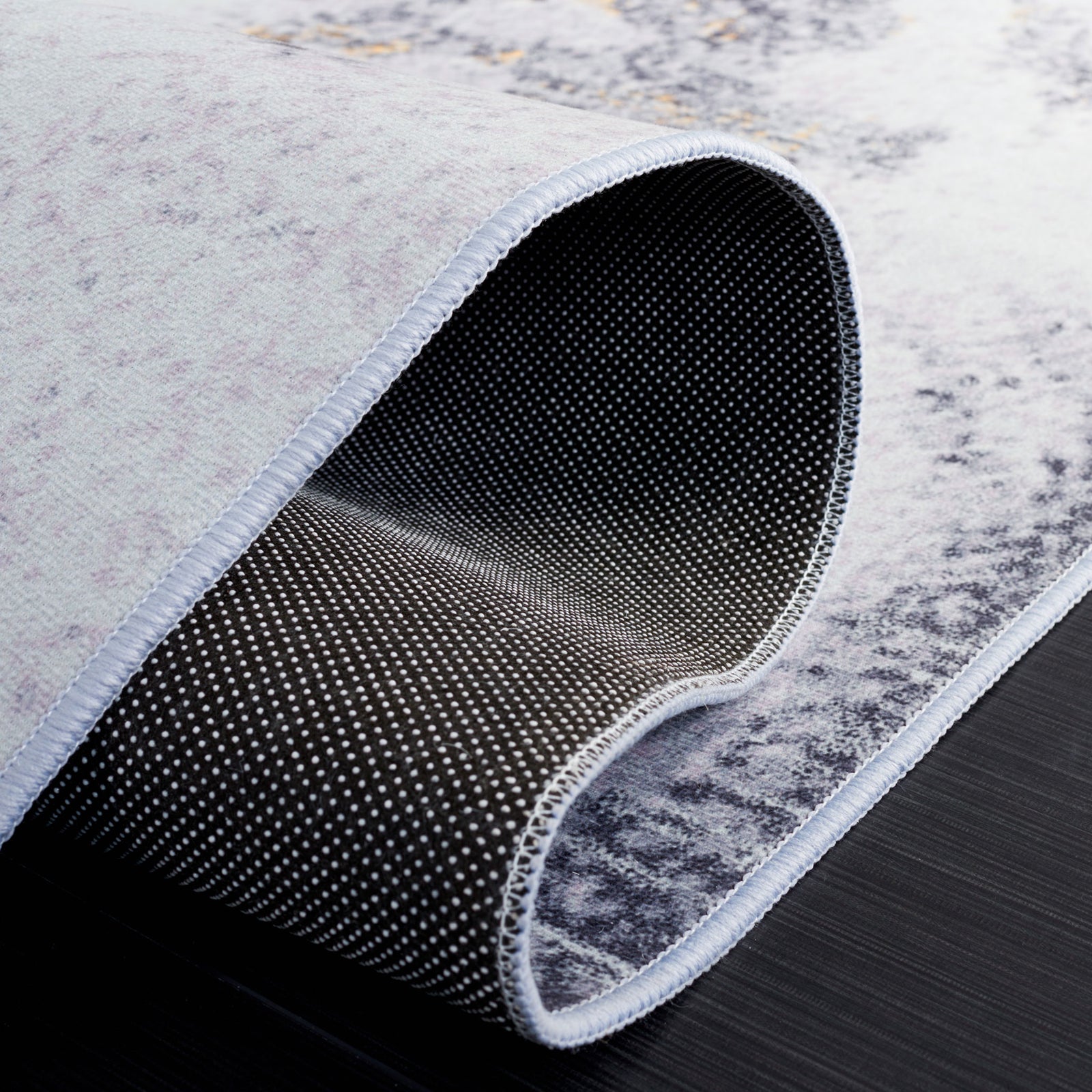 Slip-resistant dotted backing adds secure grip while flexible, washable pile bends easily || TAC803F-5 || backing_studio