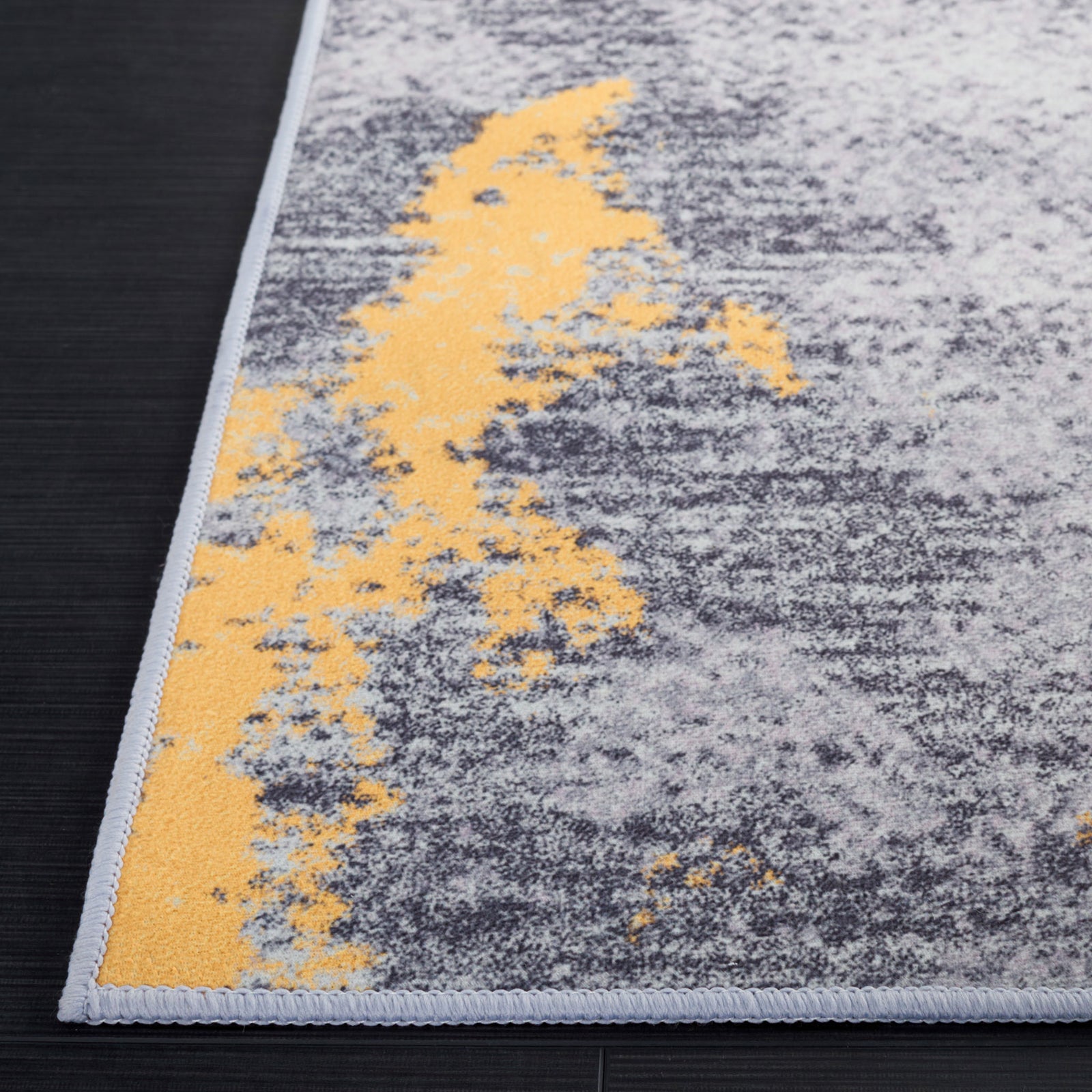Abstract gray and gold rug brings modern warmth in a low-profile, machine-washable design || TAC803F-5 || top_studio