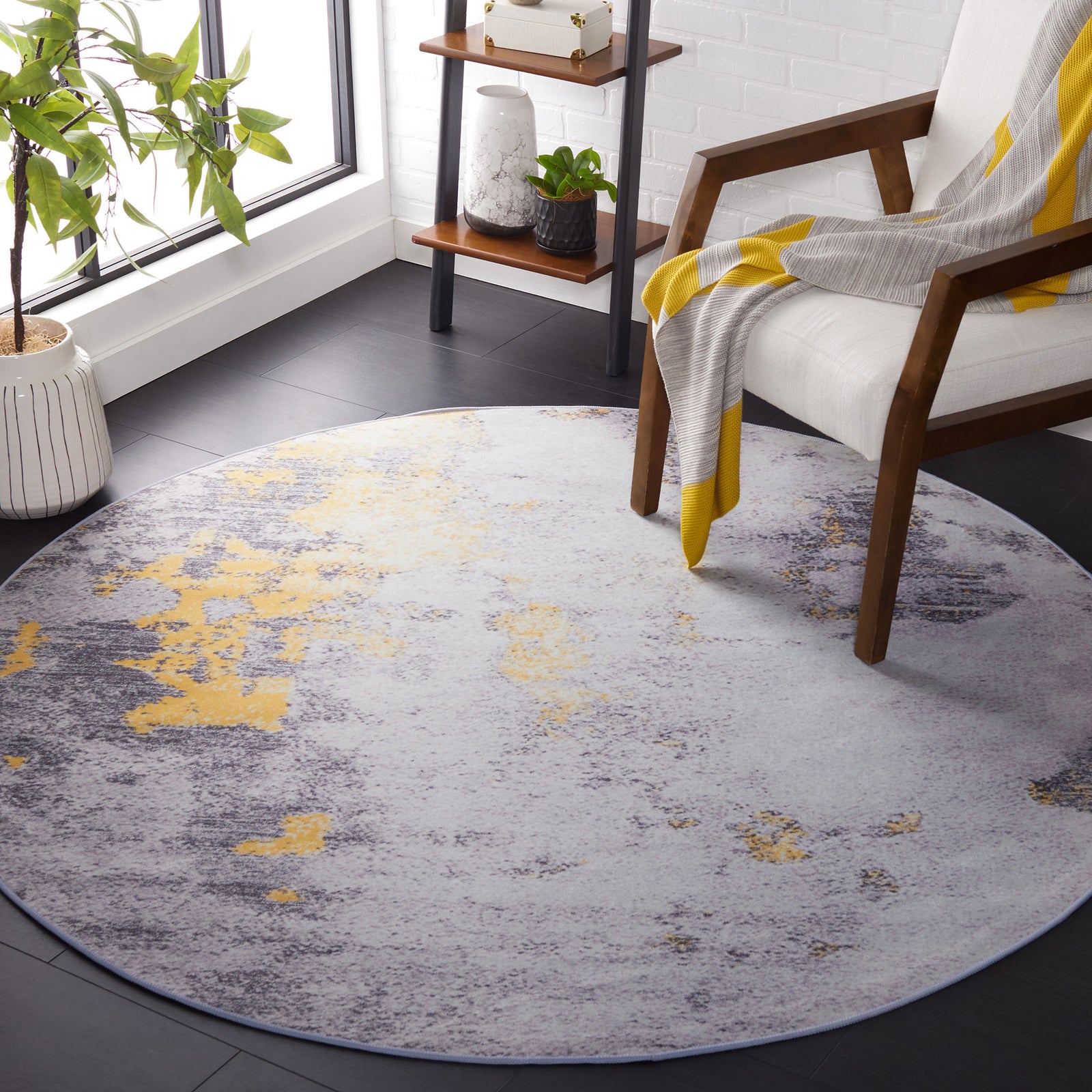 Modern round rug in gray and gold brightens the space with its soft, washable texture || TAC803F-6R || front_angle_room