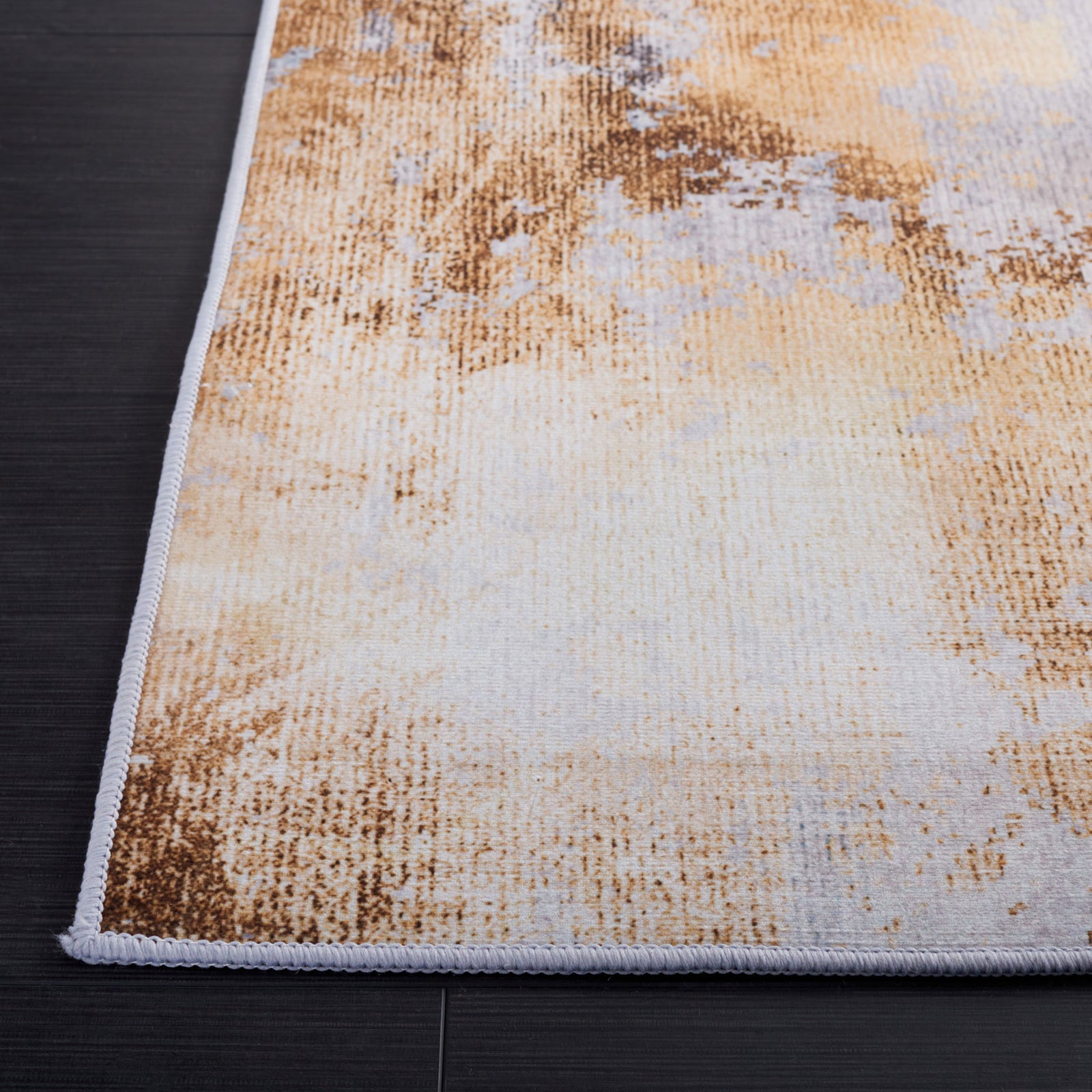 Abstract gray and gold rug with soft, low-profile pile and crisp serged edges || TAC805F-5 || top_studio