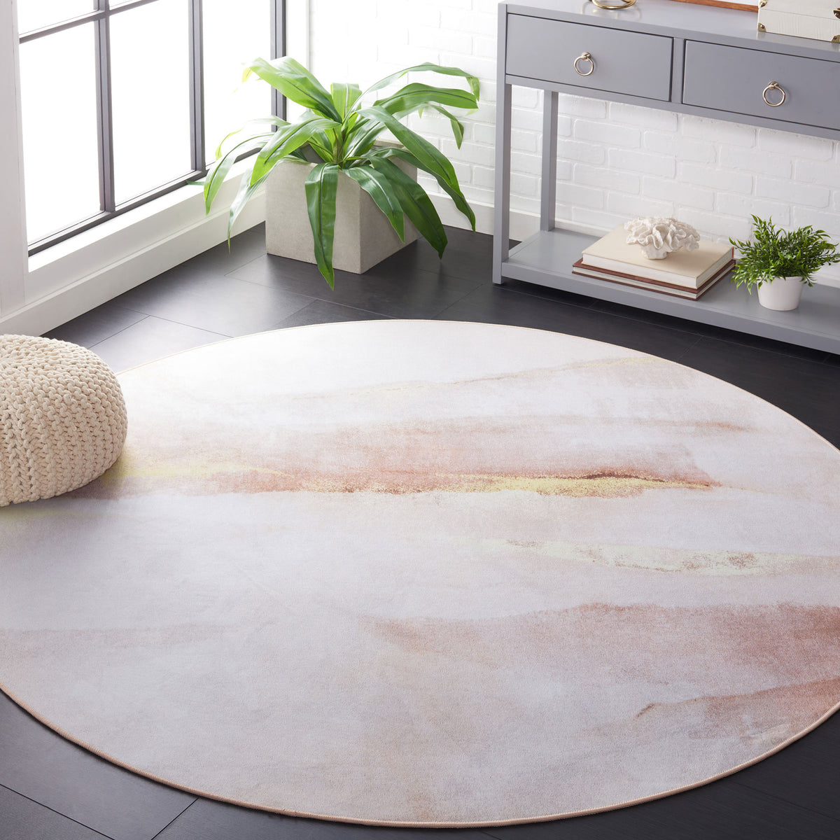 Round beige and gold abstract rug brings a serene, modern accent to the room || TAC807B-6R || top_room