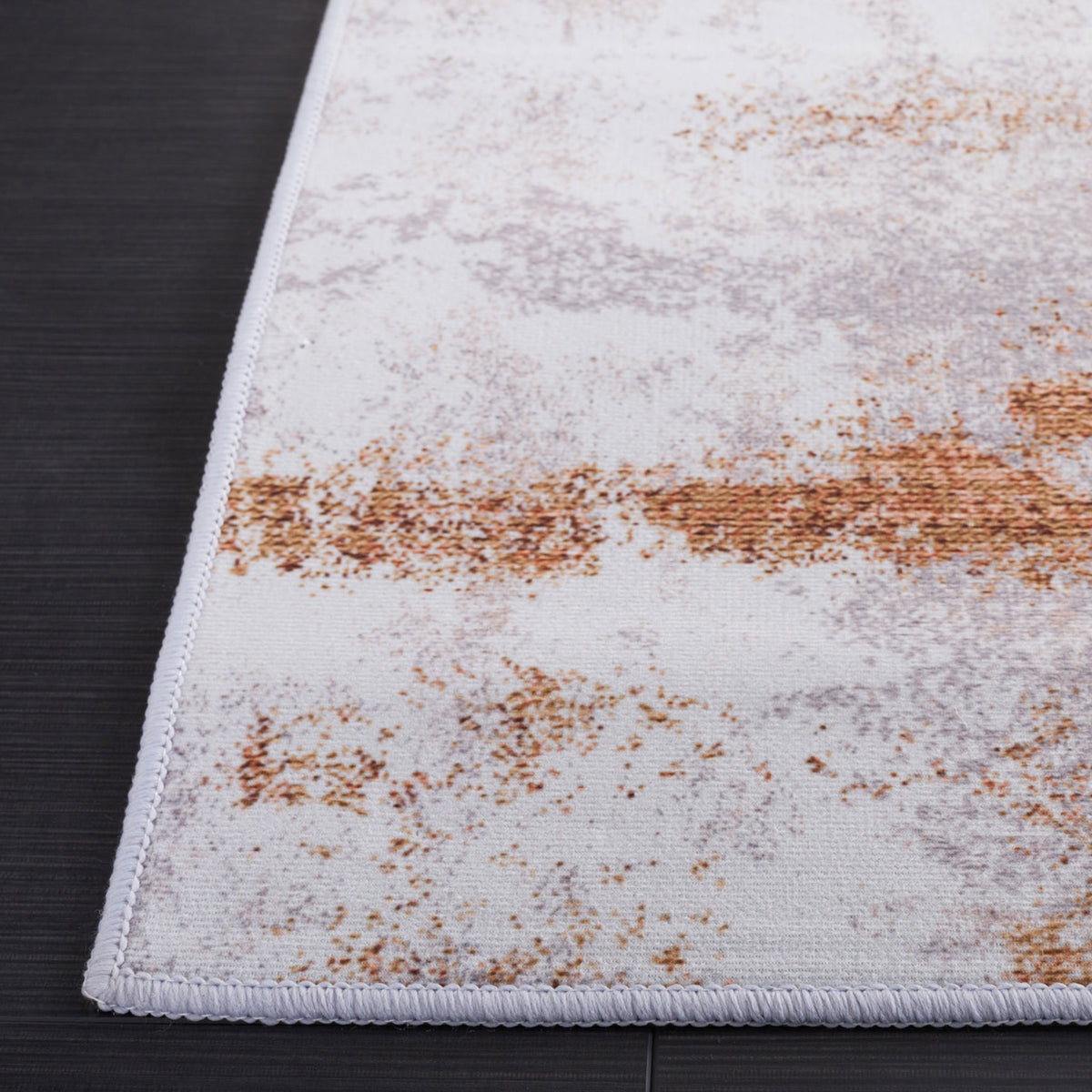 Serged edge and finely woven surface highlight the rug's sleek, low-profile construction || TAC808P-5 || corner_studio