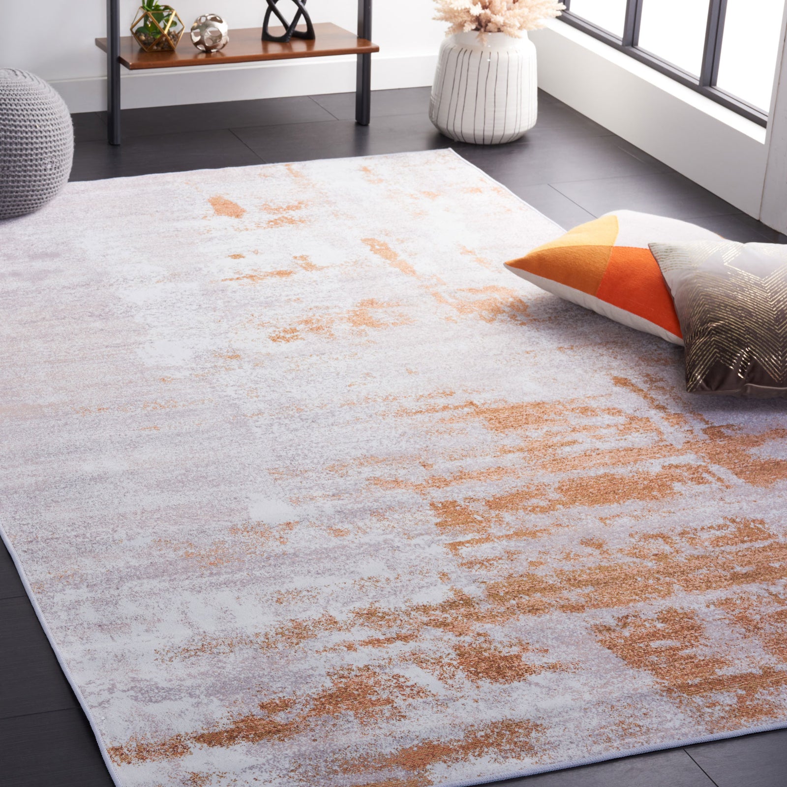 Gray and rust rug anchors the space with a clean, modern look and soft underfoot feel || TAC808P-5 || top_angle_room