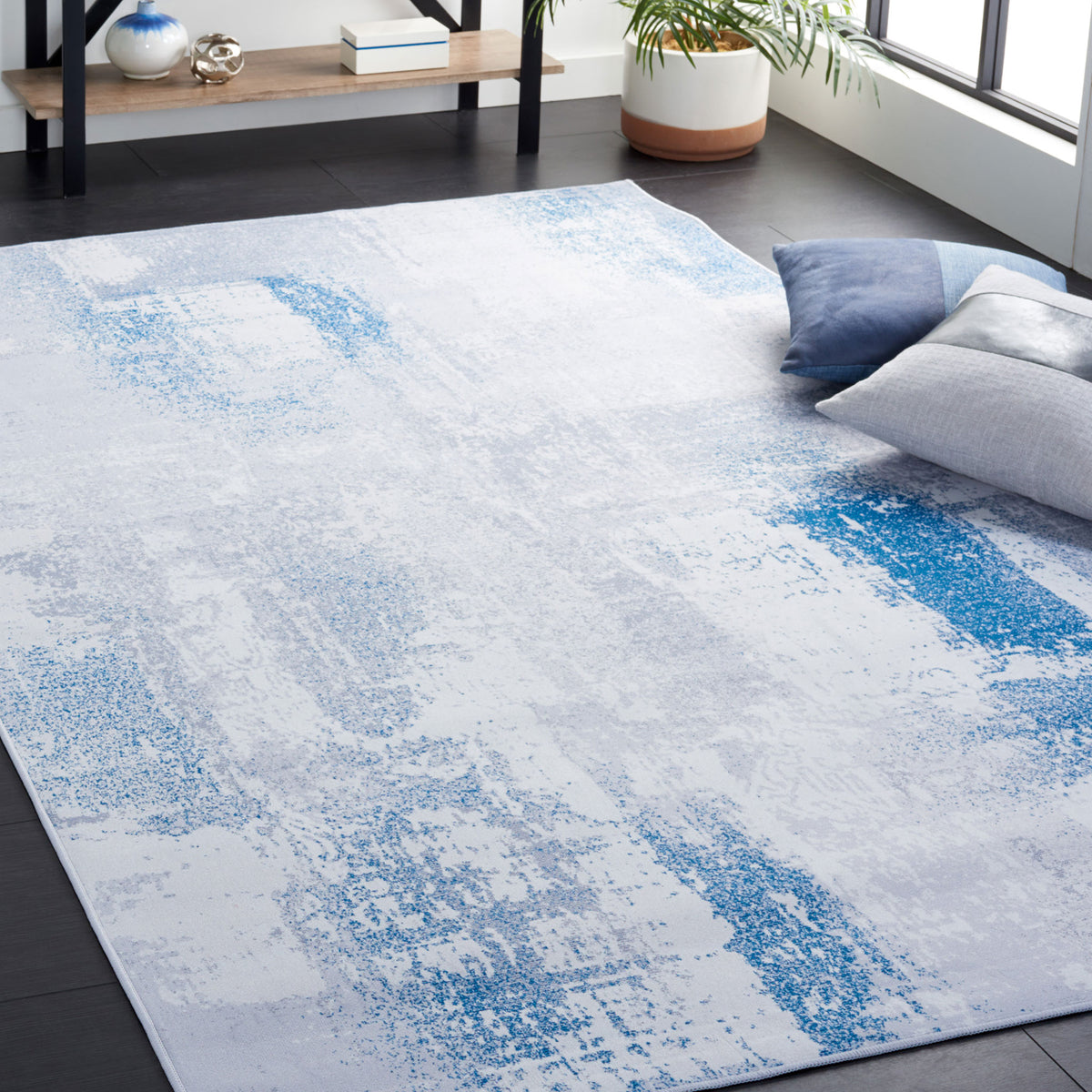Modern abstract gray and blue rug adds a cool, airy touch to living spaces || TAC814F-5 || top_angle_room