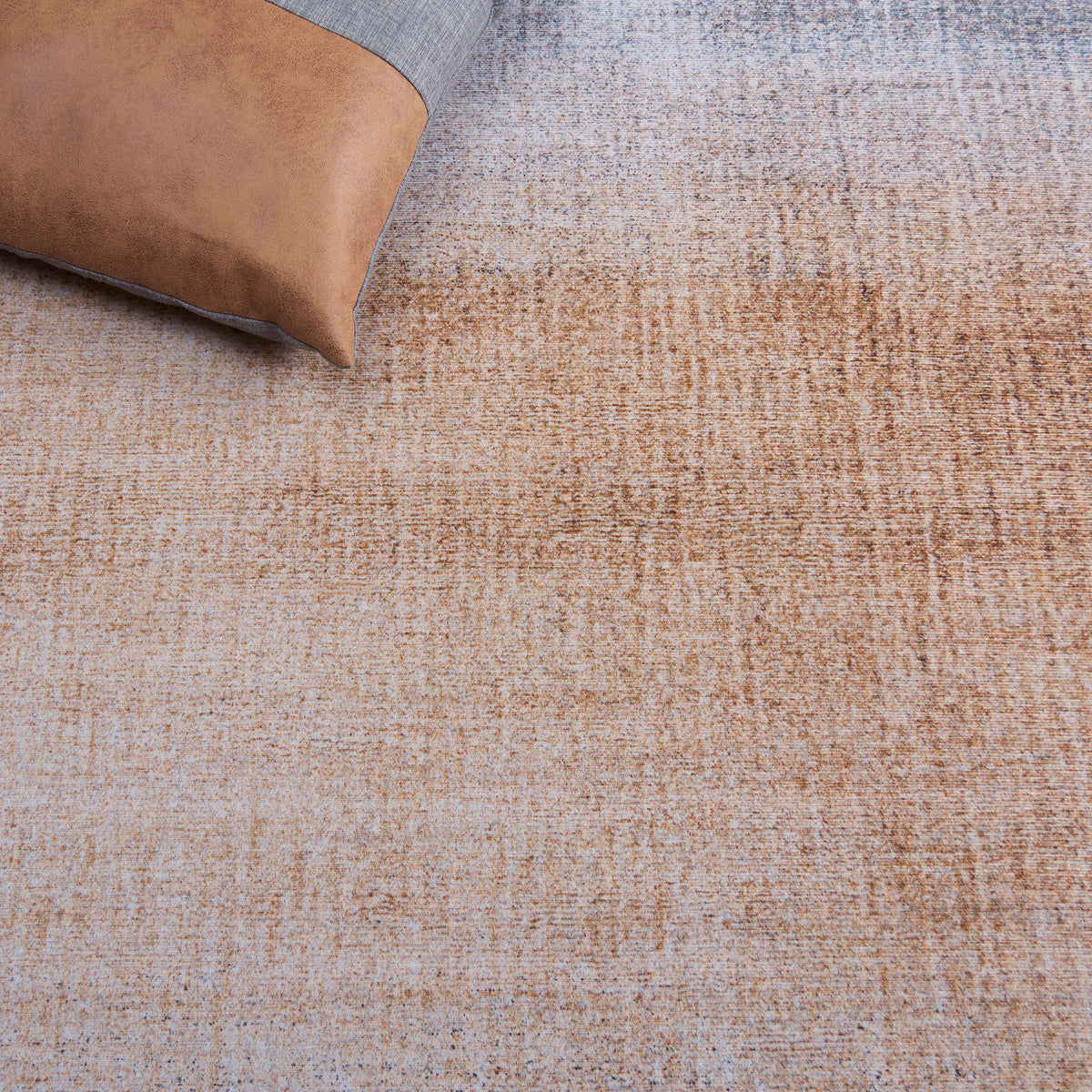 Textured ombre surface in warm rust tones pairs effortlessly with contemporary accents. || TAC816F-5OV || detail_room