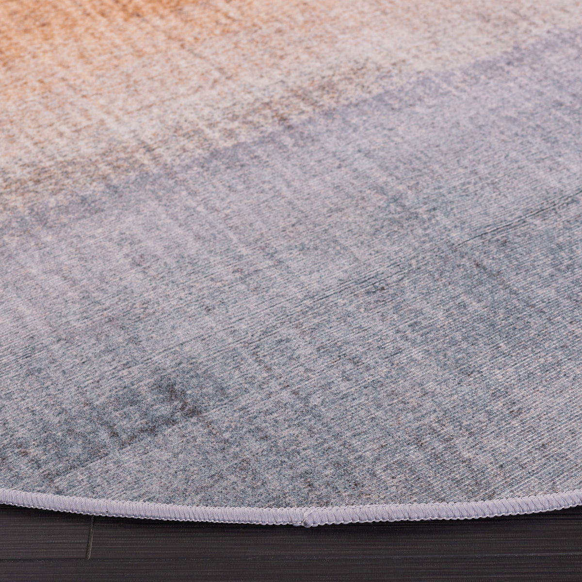Finely bound edge and soft, low-profile pile with subtle ombre shading. || TAC816F-6R || detail_room