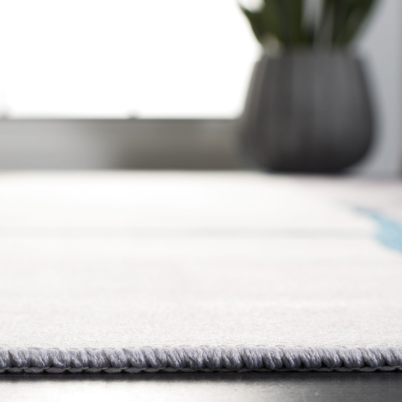 Low-profile pile feels soft underfoot and fits easily under doors and furniture || TAC820F-5 || detail_room